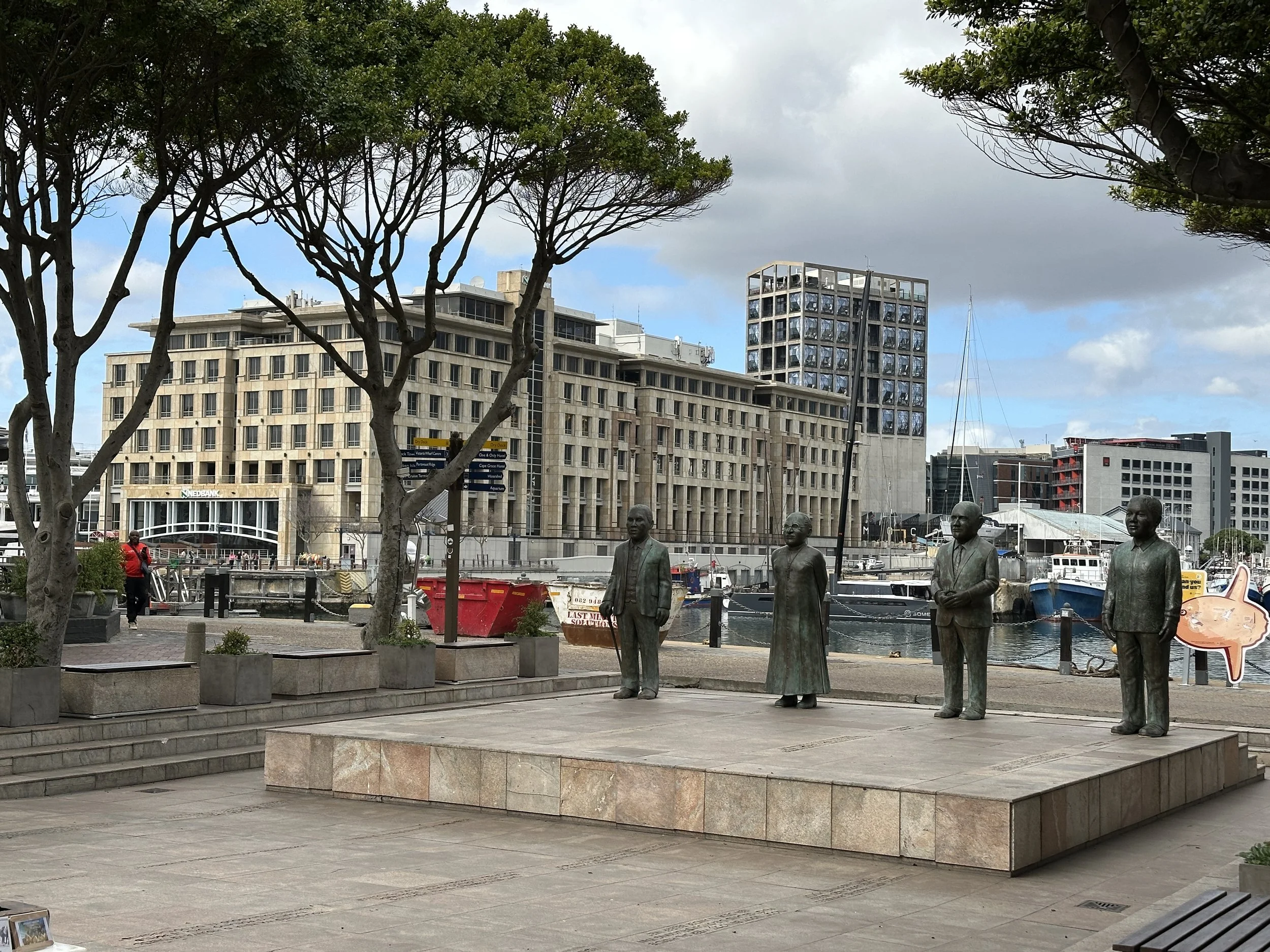 A public memorial with bronze figures near the waterfront in Cape Town.