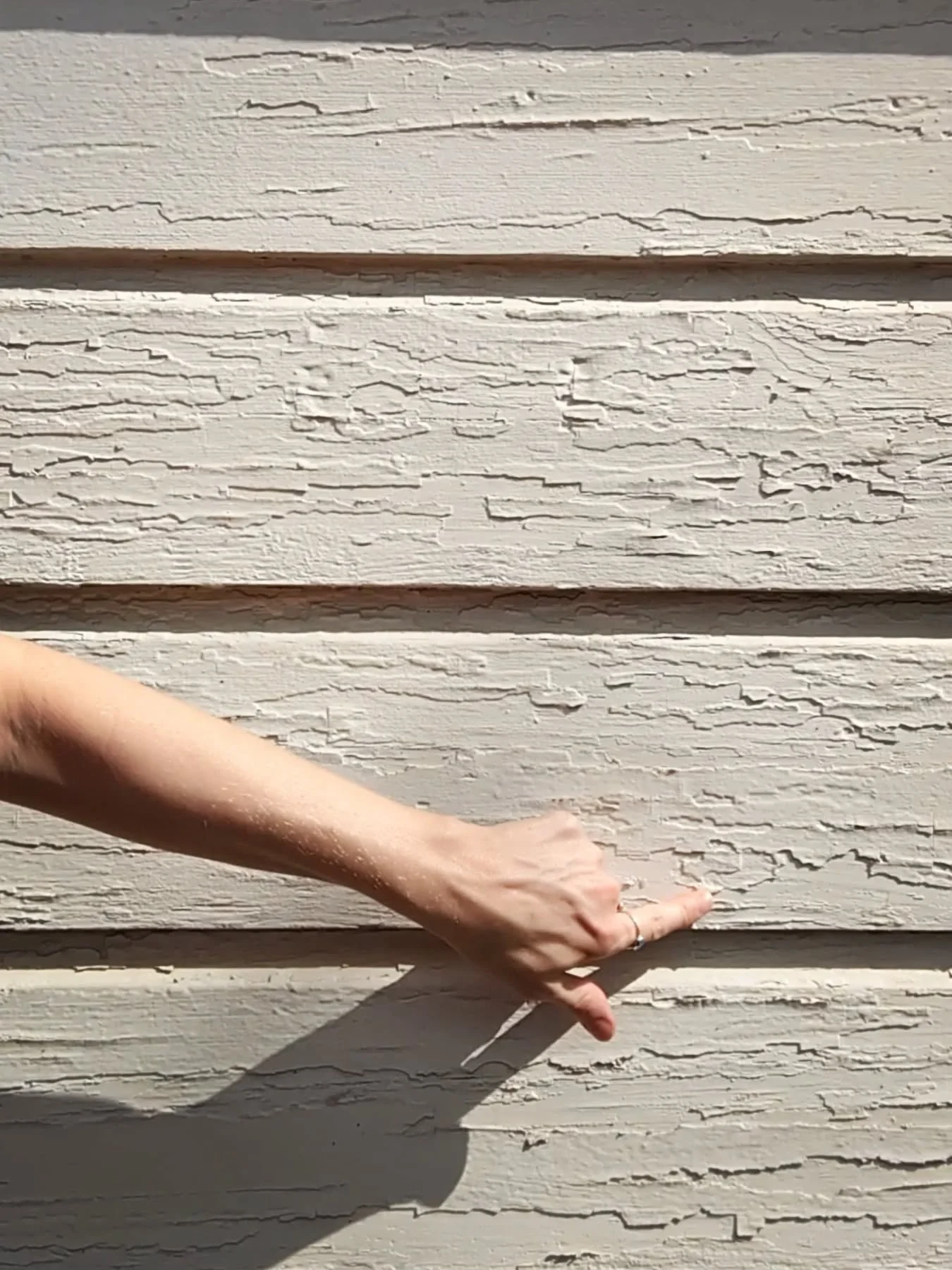 Lange Eve here, with Limelight Painting. When siding looks like this, it's more than cosmetic-- peeling paint leaves the wood exposed to moisture and rot. The good news? With the right prep, primer, and top coat, we can protect this home for years to