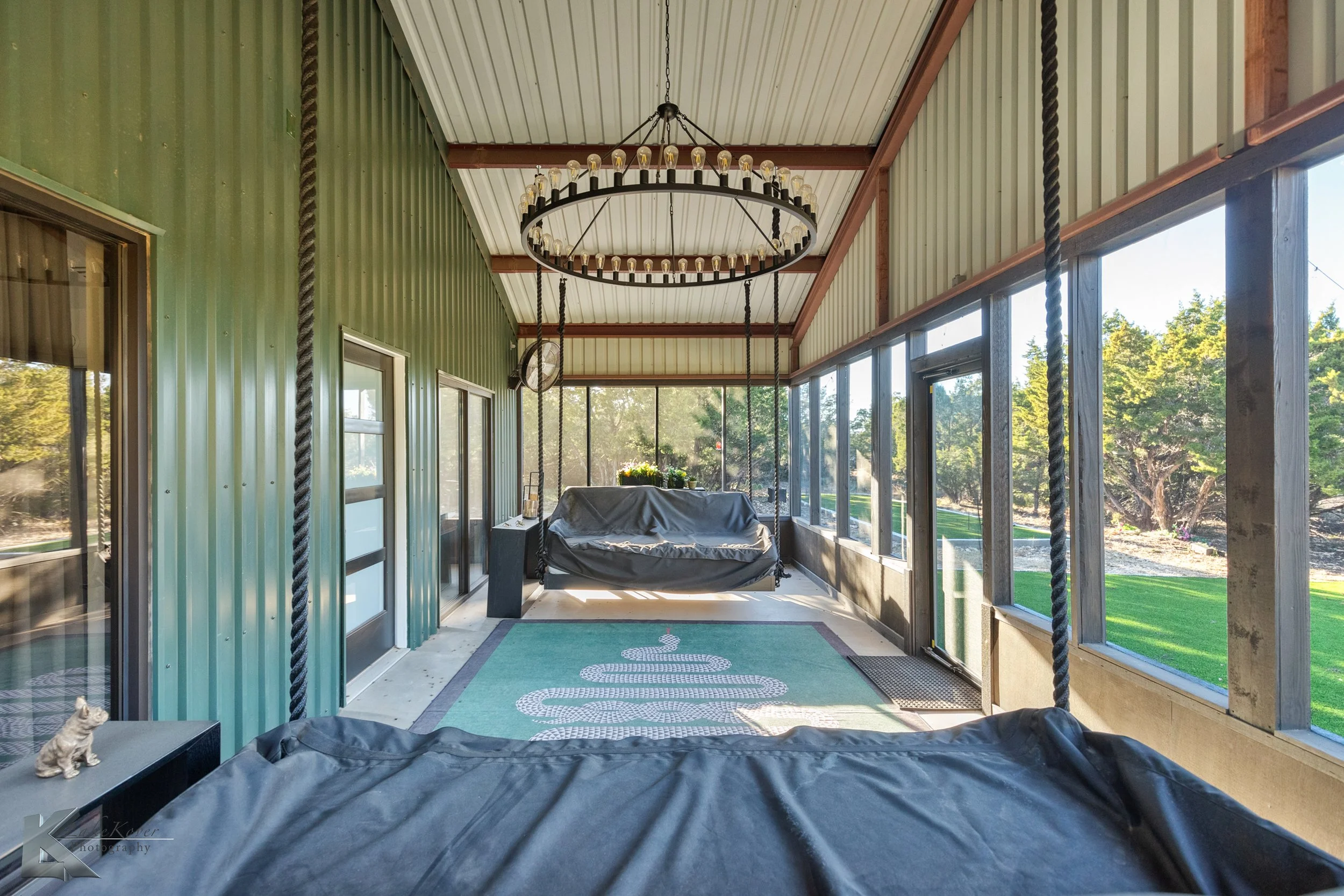 The space is configured for relaxation and entertaining and is integrated seamlessly with the north-facing screened porch.