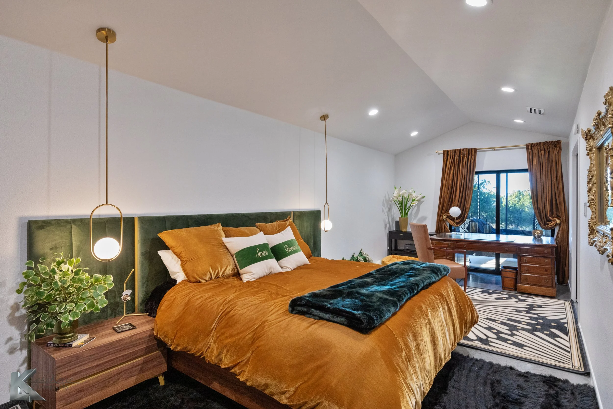 The primary bedroom includes a desk with natural lighting and outside views.