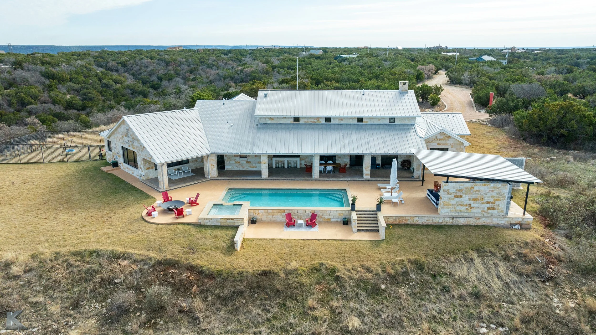 A shaded backyard cabana provides additional space to enjoy the outdoors & the views.