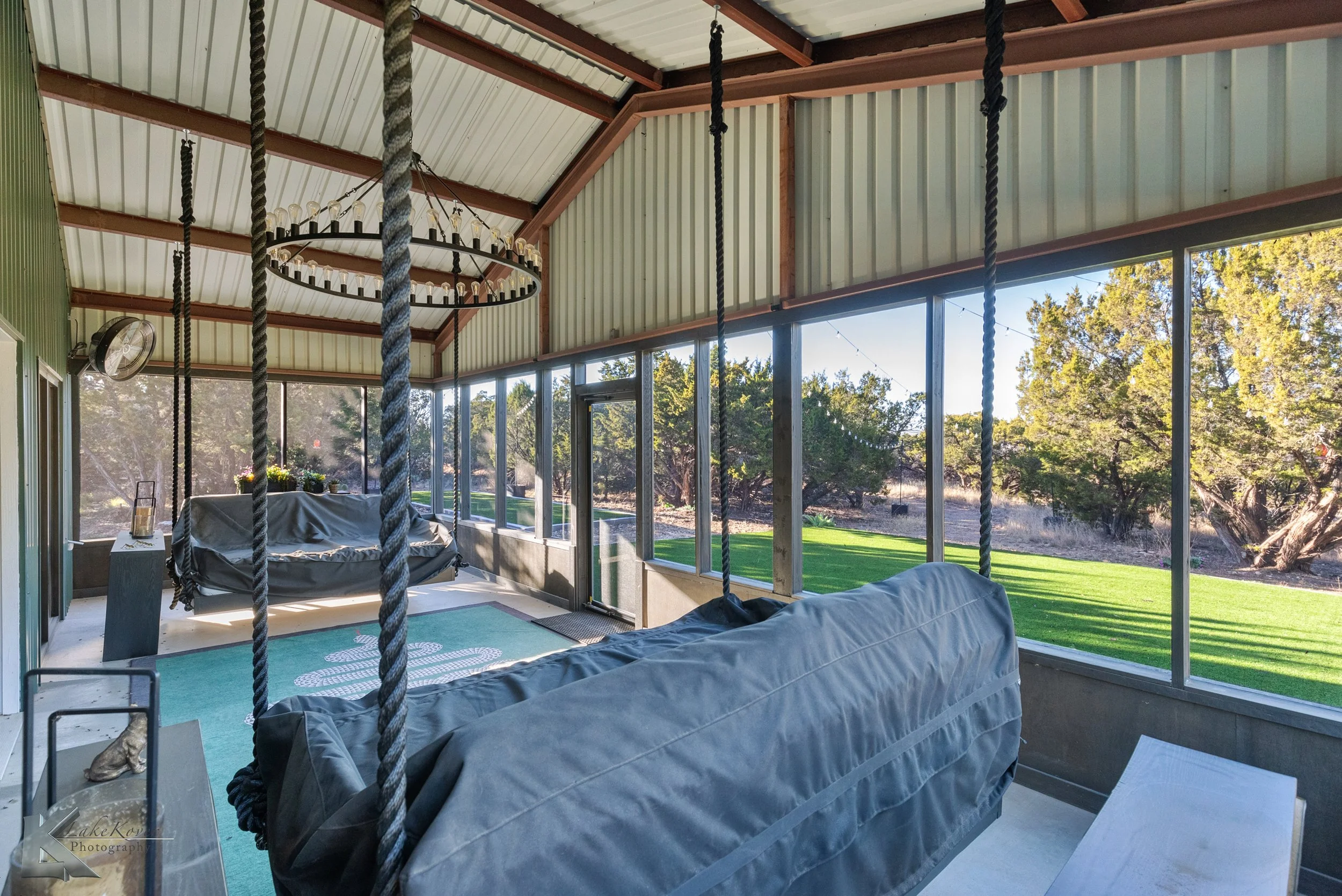 The space is configured for relaxation and entertaining and is integrated seamlessly with the north-facing screened porch.