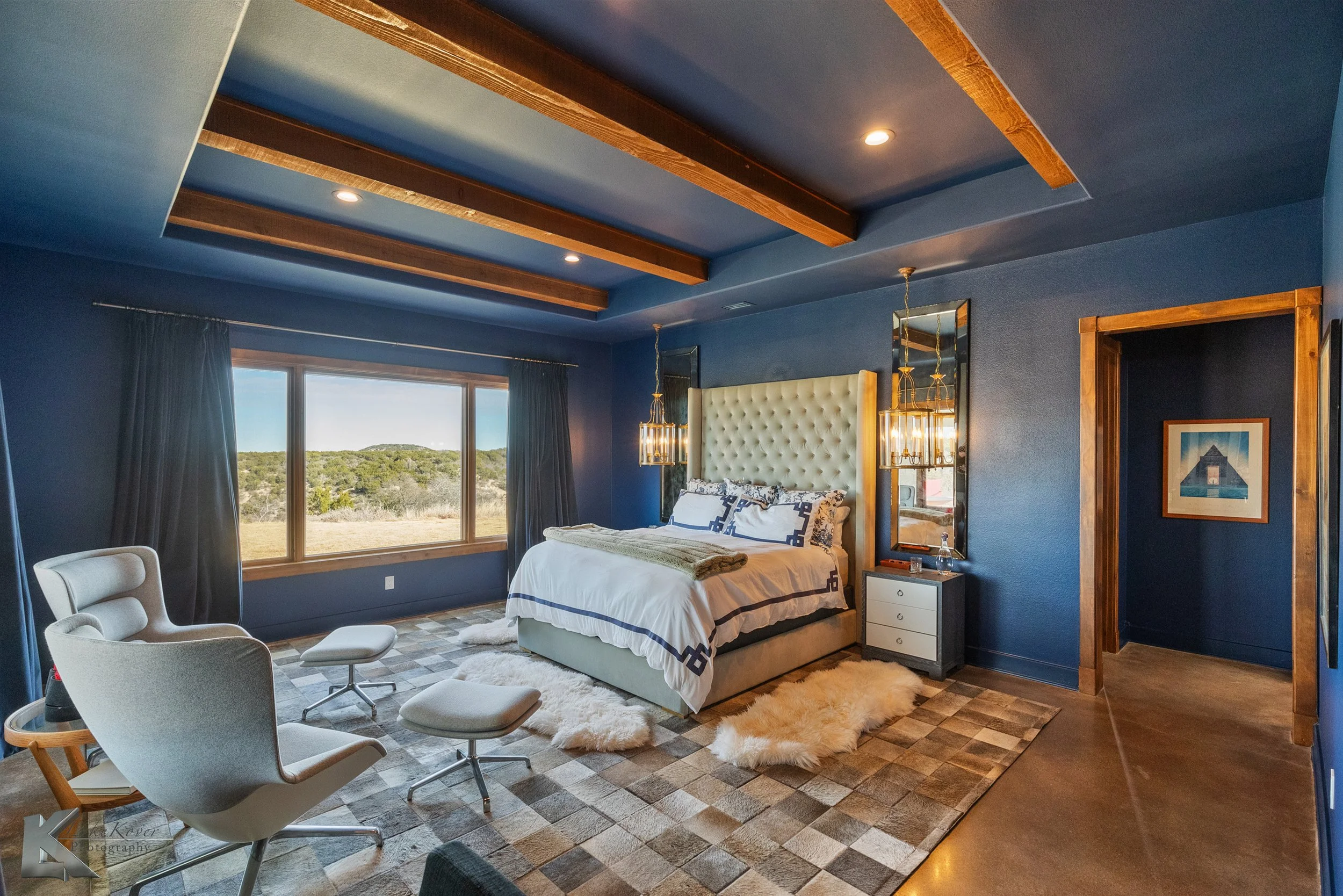 The primary suite has windows that provide expansive views to the north & west.
