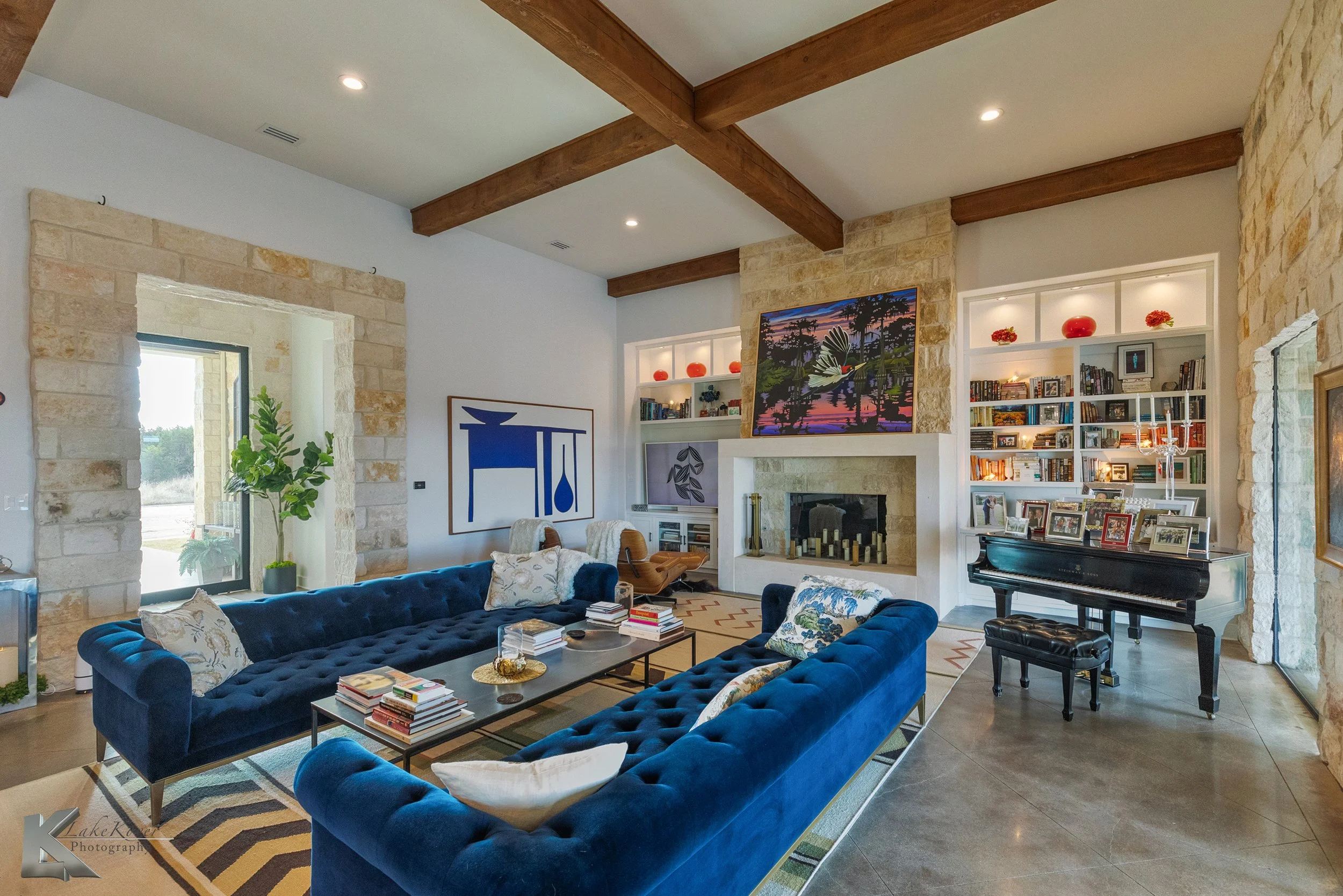 The primary axis of the home is the 48’ x 22’ open-concept great room, with a substantial limestone block fireplace and living area opposite the kitchen.