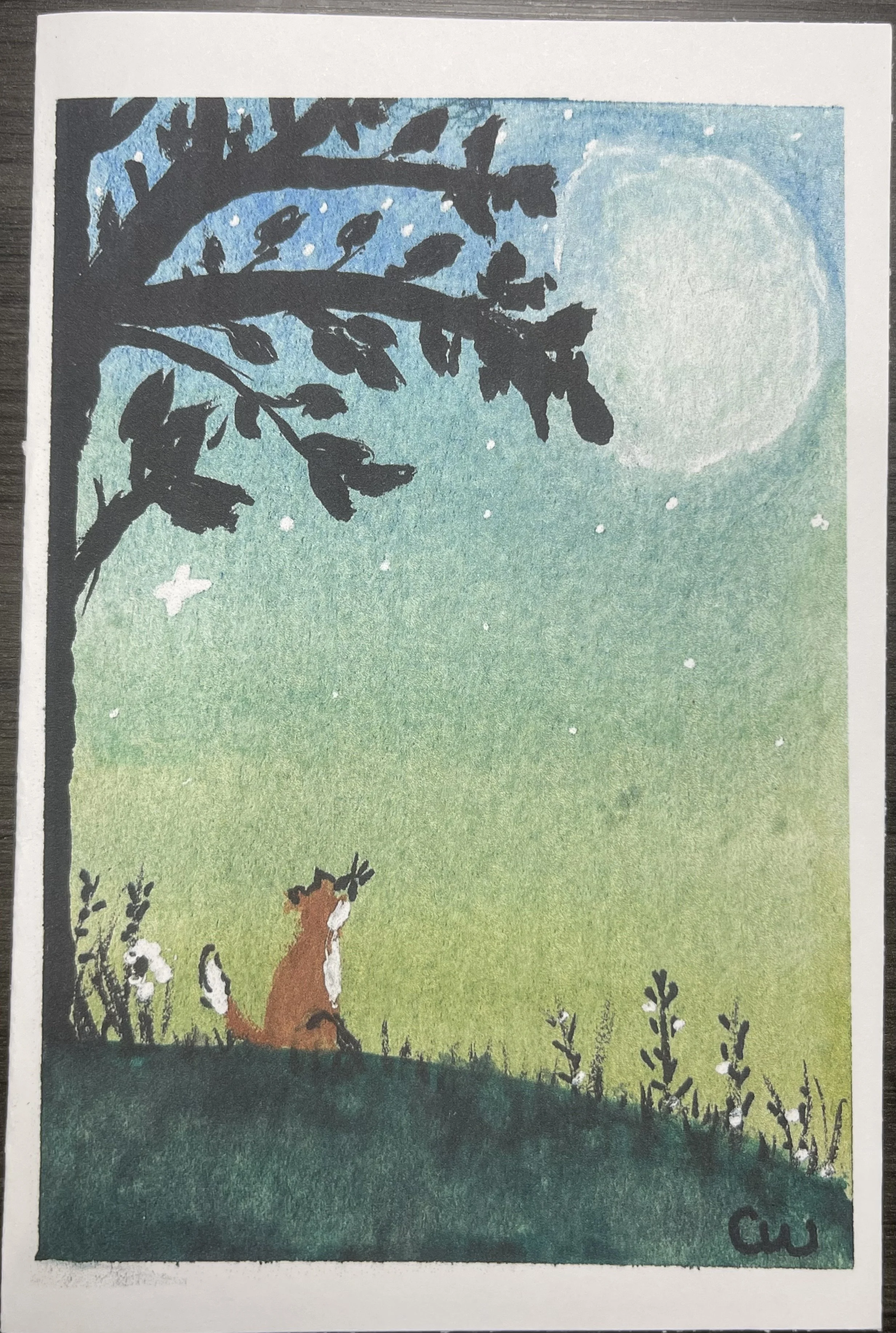 A whimsical watercolor greeting card print featuring a little fox beneath a glowing moonlit sky