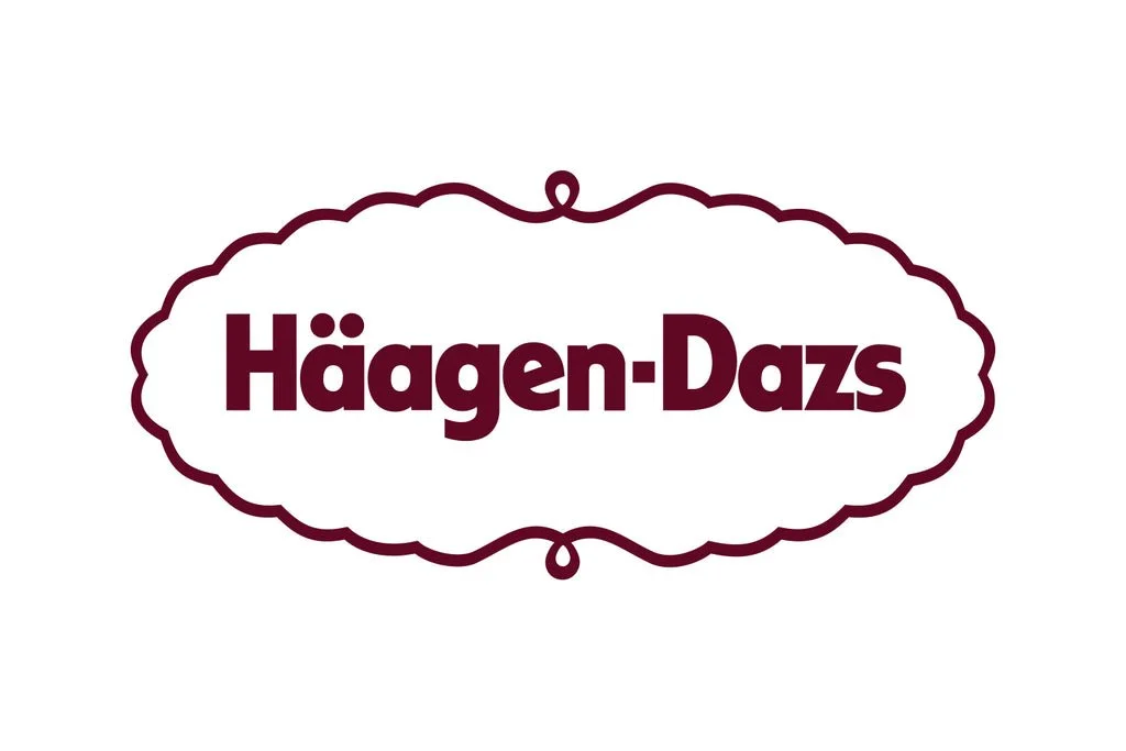 Häagen-Dazs logo in burgundy text inside a decorative oval outline