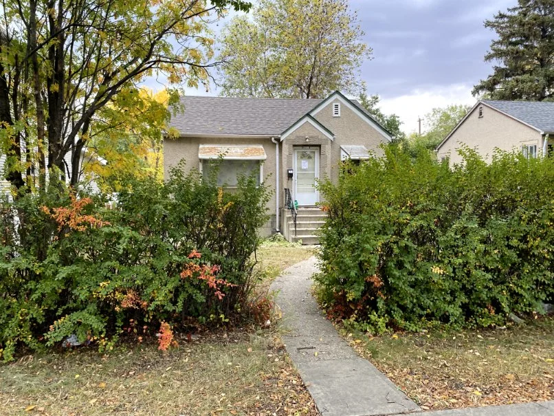 Photograph of a small single-family home.