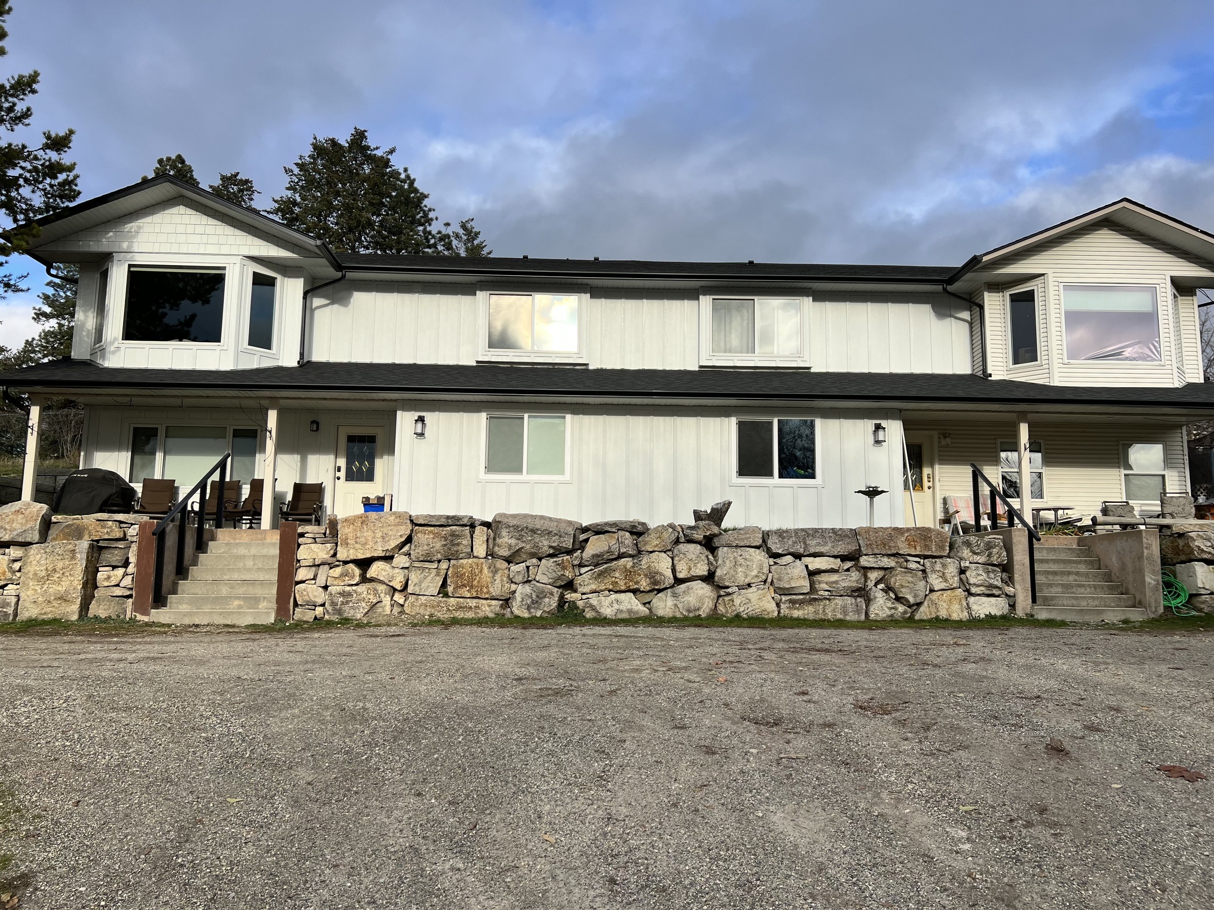 Photograph of a white duplex building.
