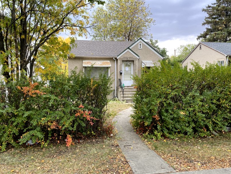 Photograph of a small single-family house.