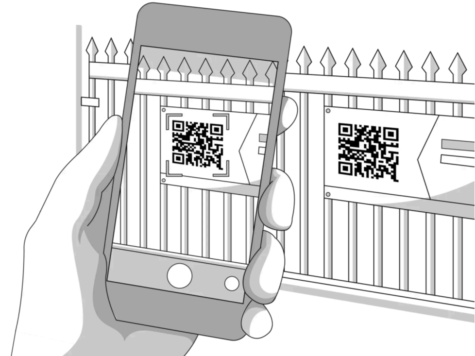 A person holds a smartphone taking a photo of a QR code on a fence. The fence has two QR codes attached to it.
