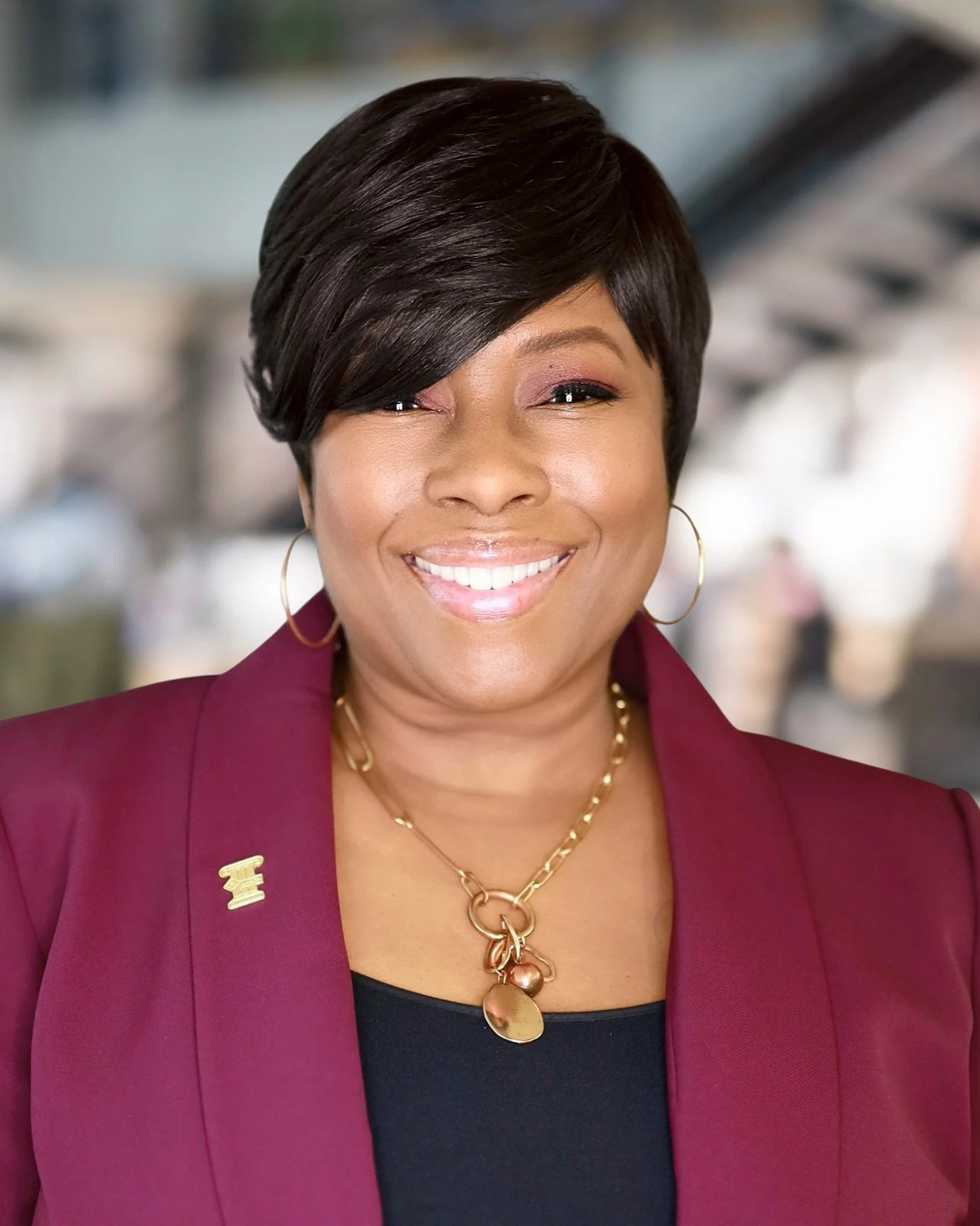 Headshot of Shelia Higgs Burkhalter in Plum suit.