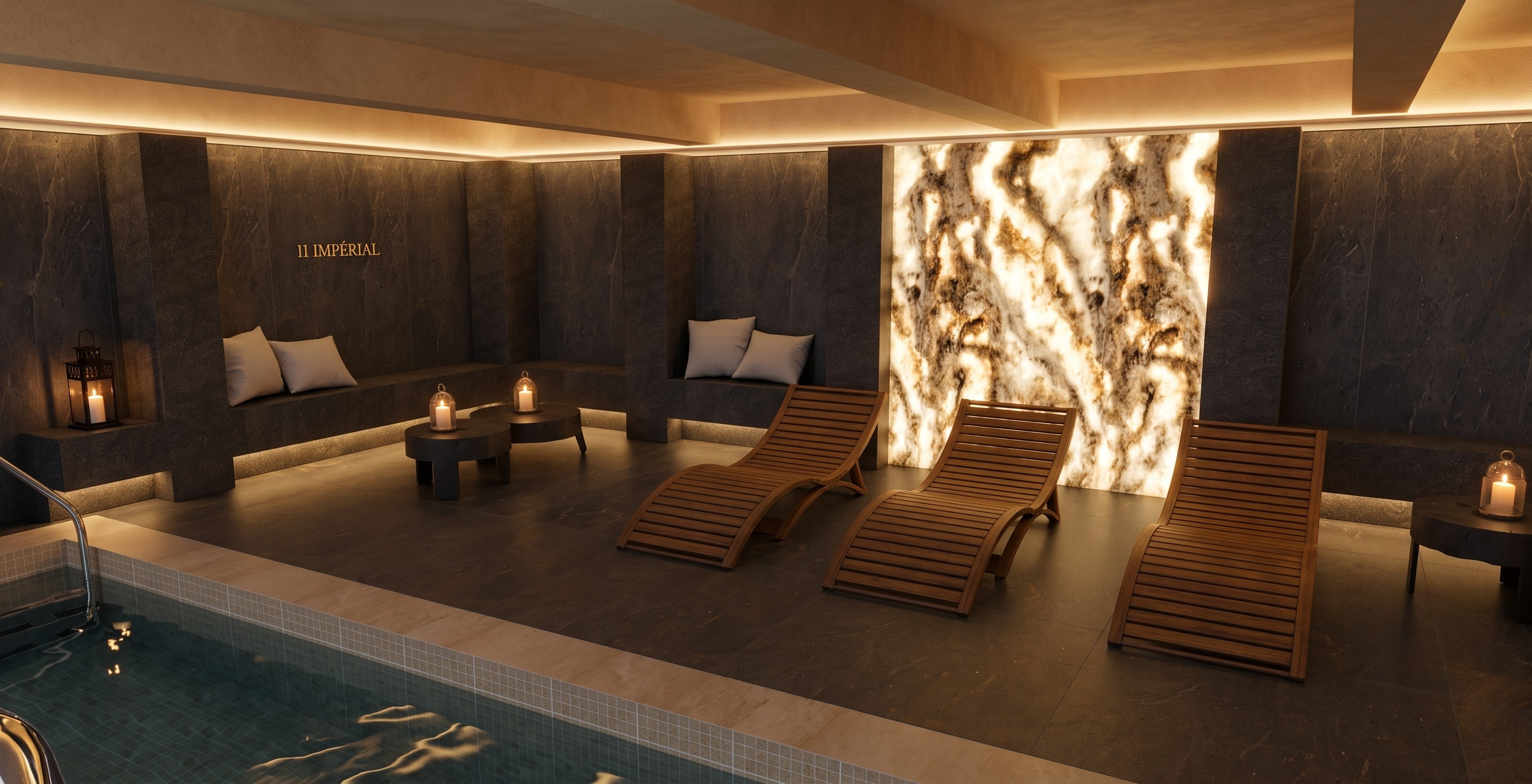 Une salle spa moderne avec des chaises longues en bois, cocooning, ambiance tamisée, bassin, piscine, carrelage, un mur en pierre, un panneau en feuille de pierre lumineux, et un panneau indiquant 11 IMPÉRIAL haut de gamme, luxe Anthony Mambré Design