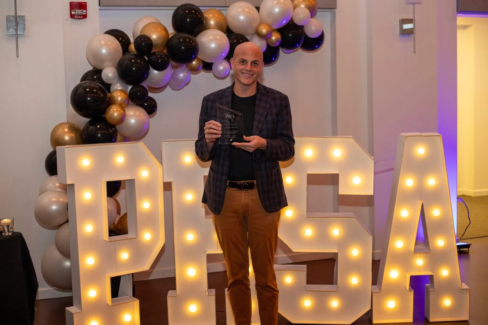 Bradley Harris receiving the Public Relations Society of America Best of West Virginia Award for public affairs and stakeholder engagement strategy.