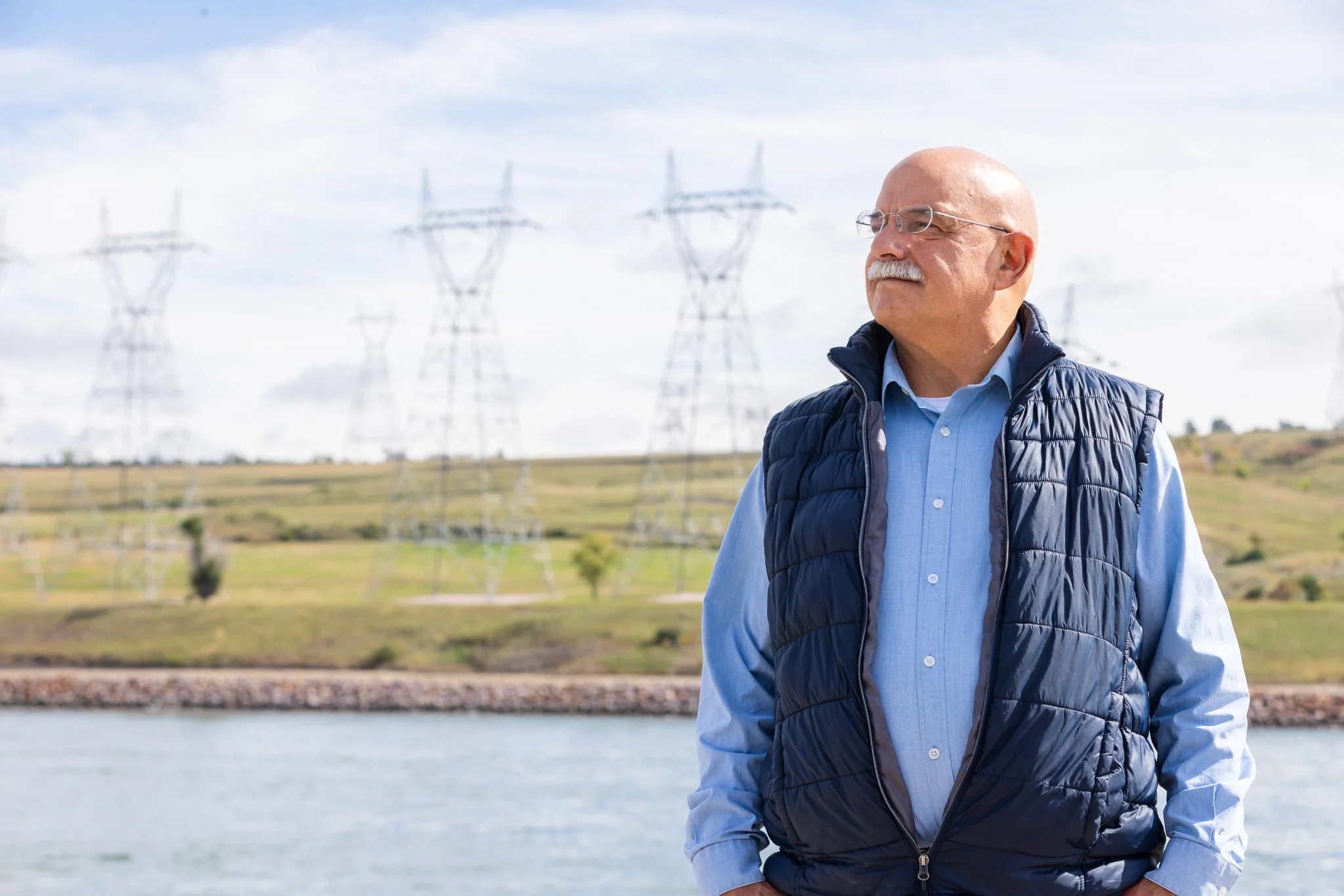 Don Haggar with transmission lines in the background