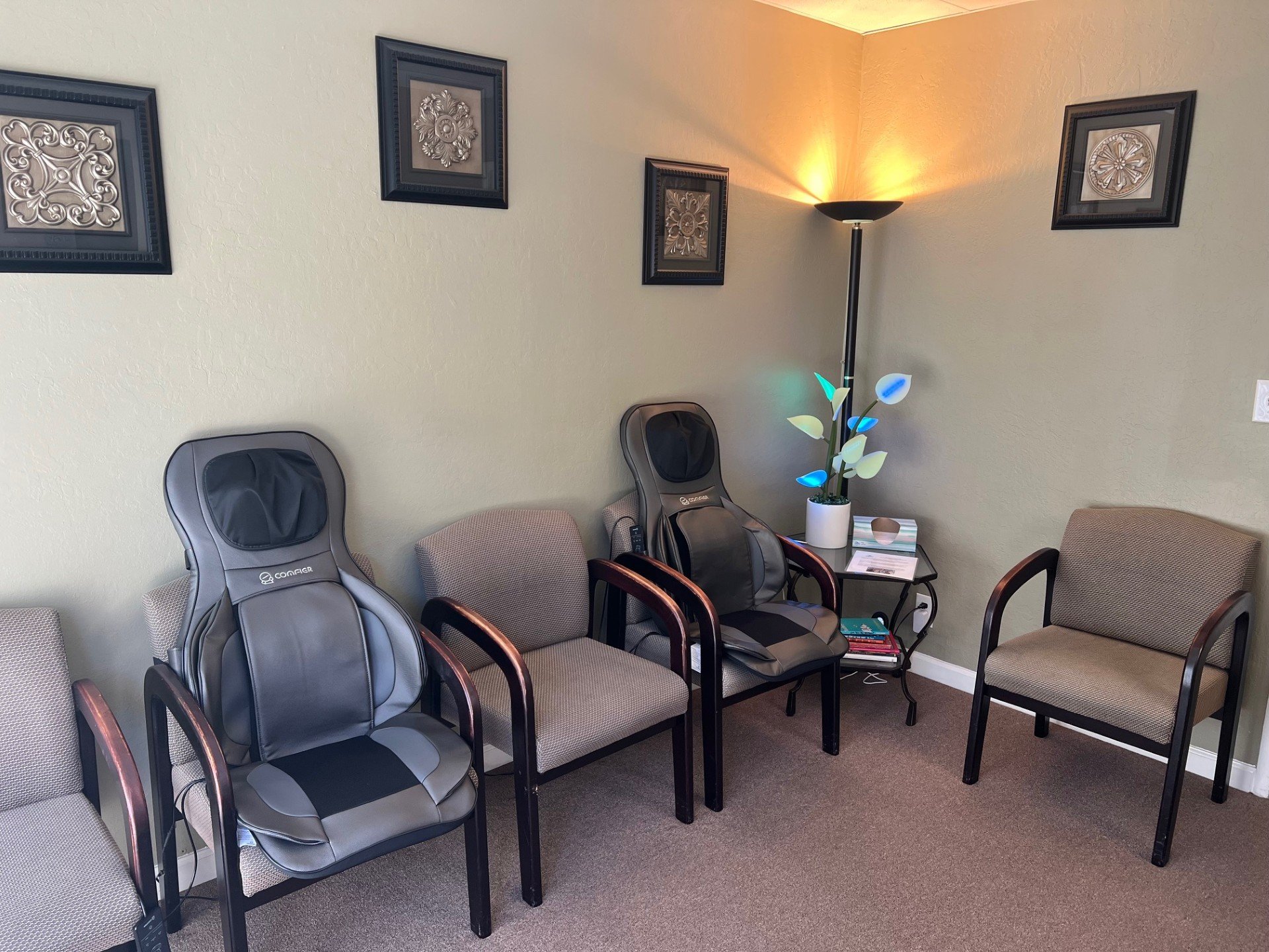 Redwood Chiropractic waiting room with two deluxe massage chairs to use while you wait.