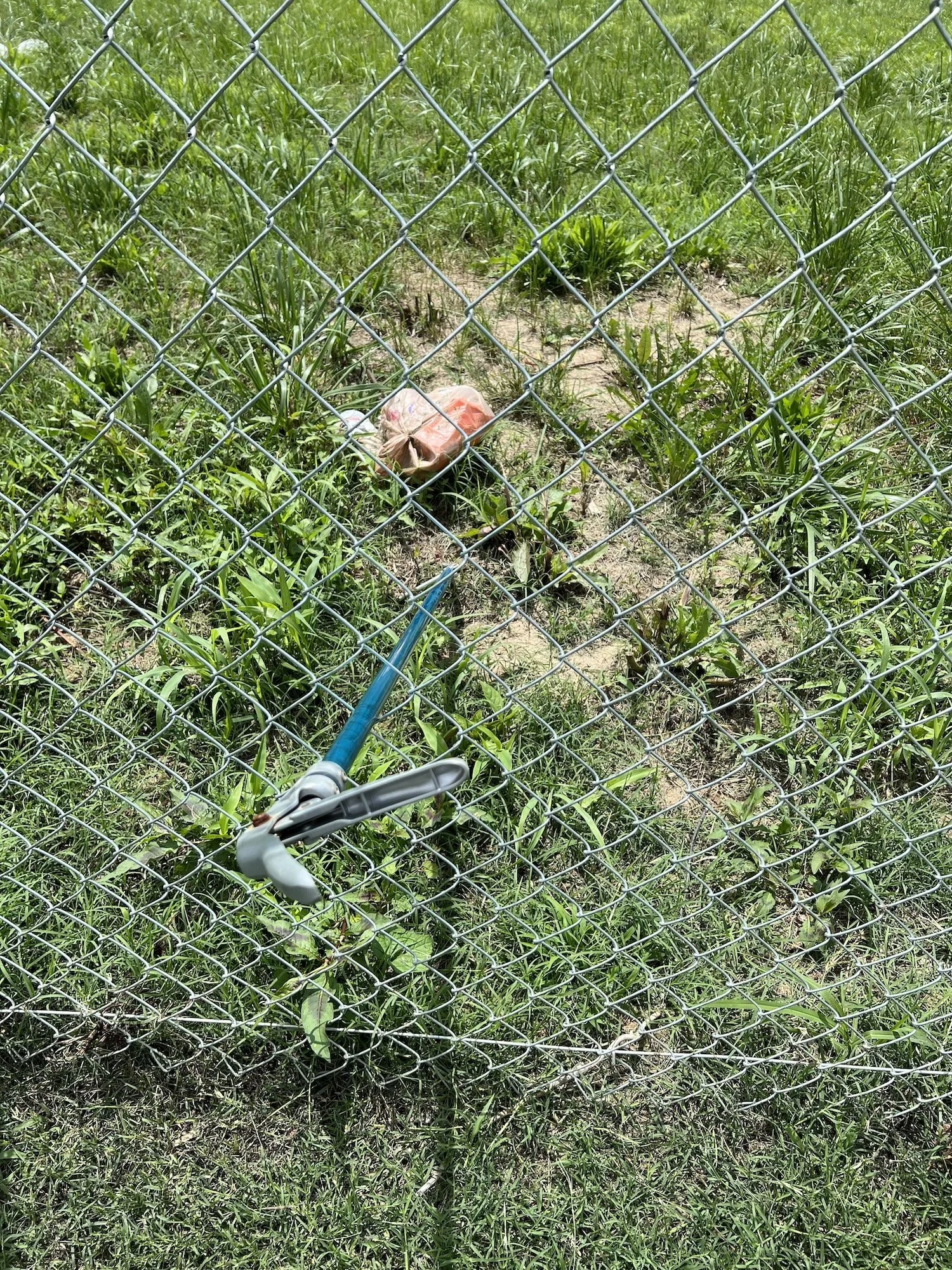 Attempted trash removal highlights early maintenance challenges at the installation site.