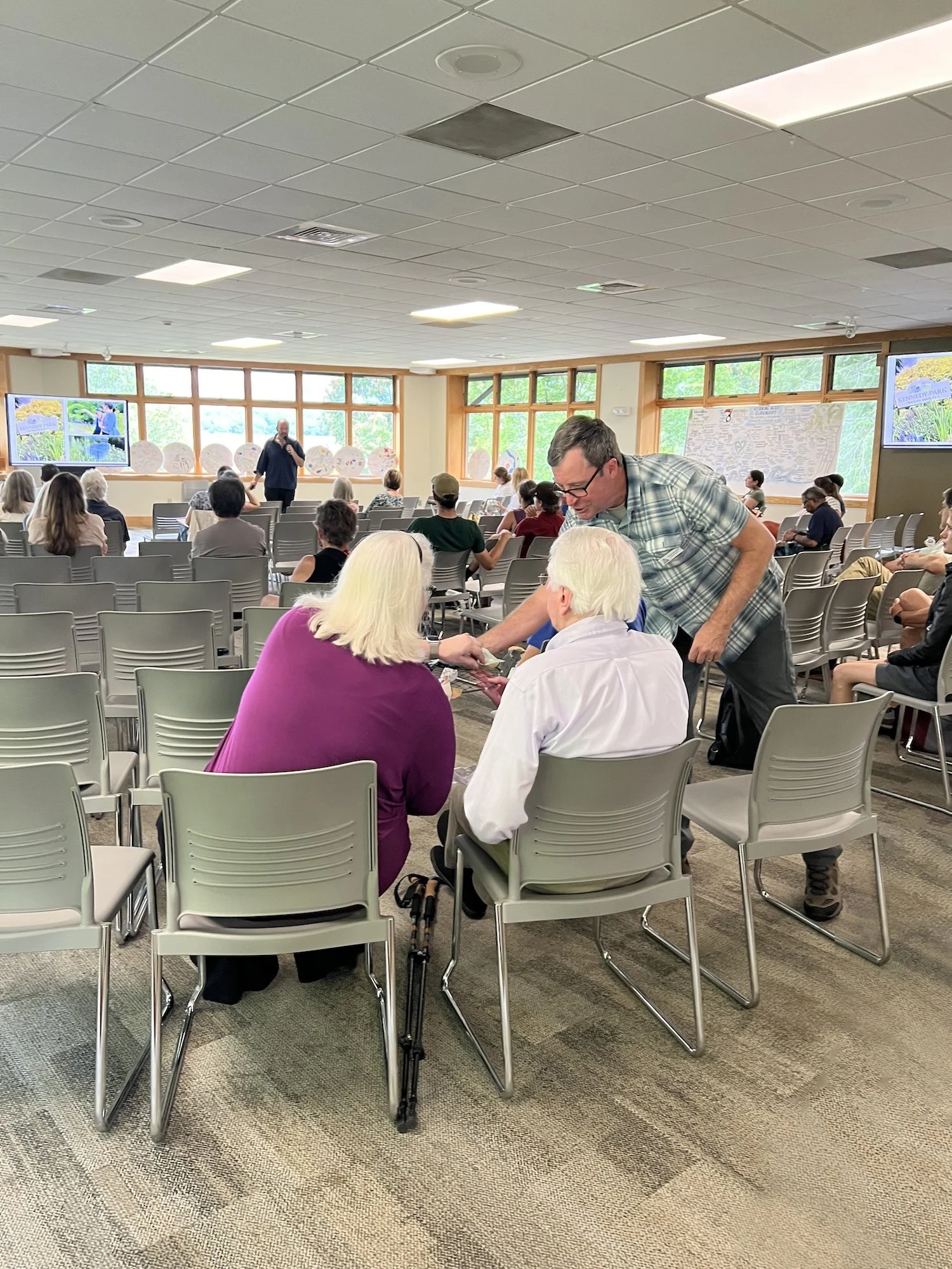 During the June 2025 climate summit at Warren Wilson College, guests tied strips to mesh panels later added to the fence.