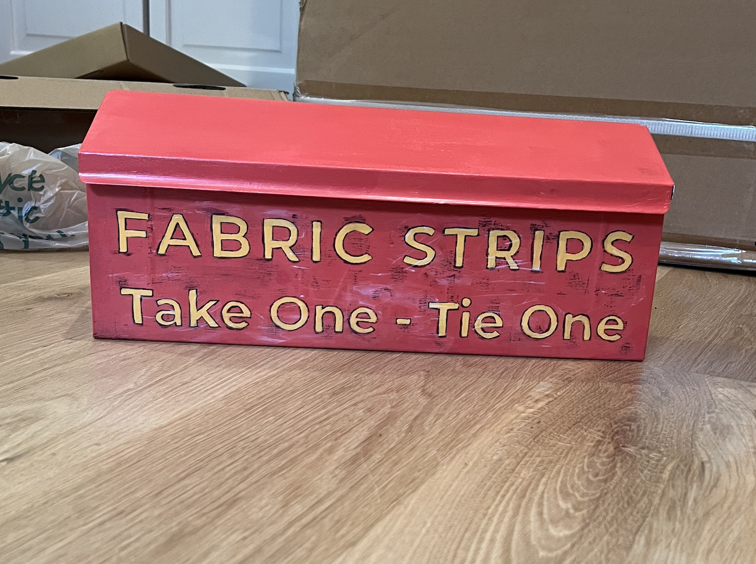 Hand-painted metal replacement box curing in the artist’s studio before installation.