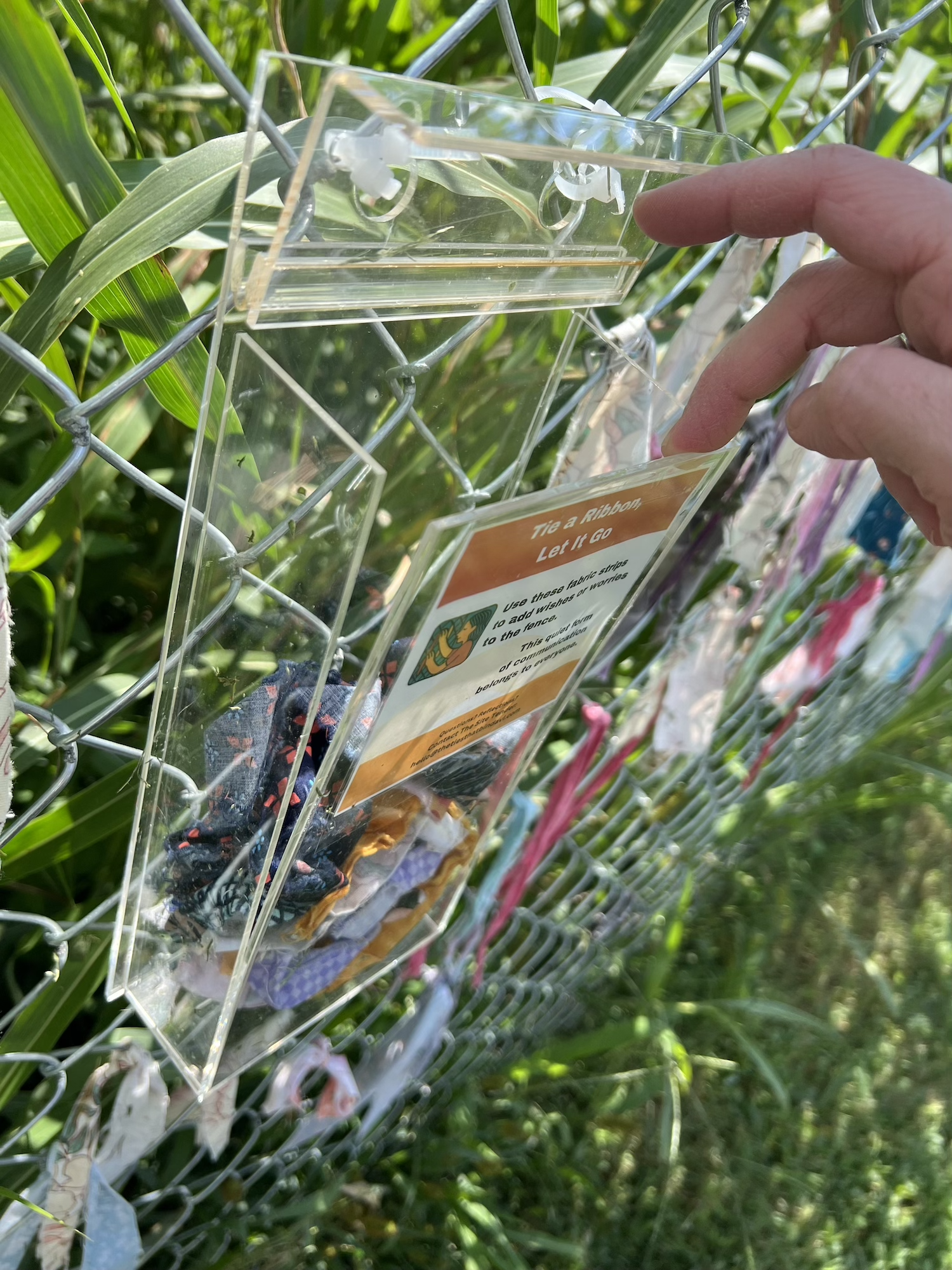 During a site visit, the front panel of the fabric distribution box was found loose.