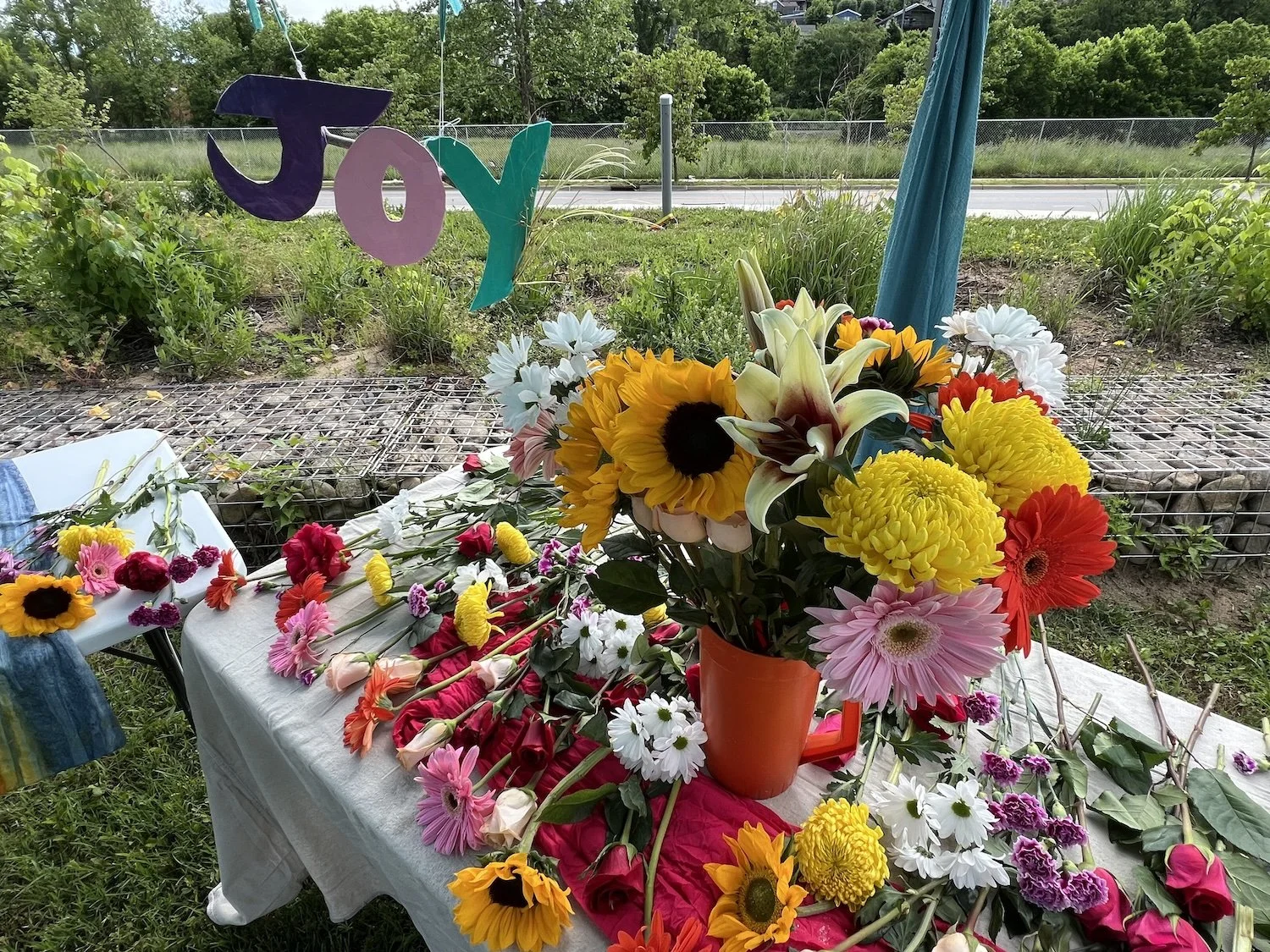 This project began with the 2nd Annual Gathering of Grief & Joy. Hosted by Kristie Beth Ihde, the event invited participants to “symbolically release grief and celebrate the sweetness of life.”
