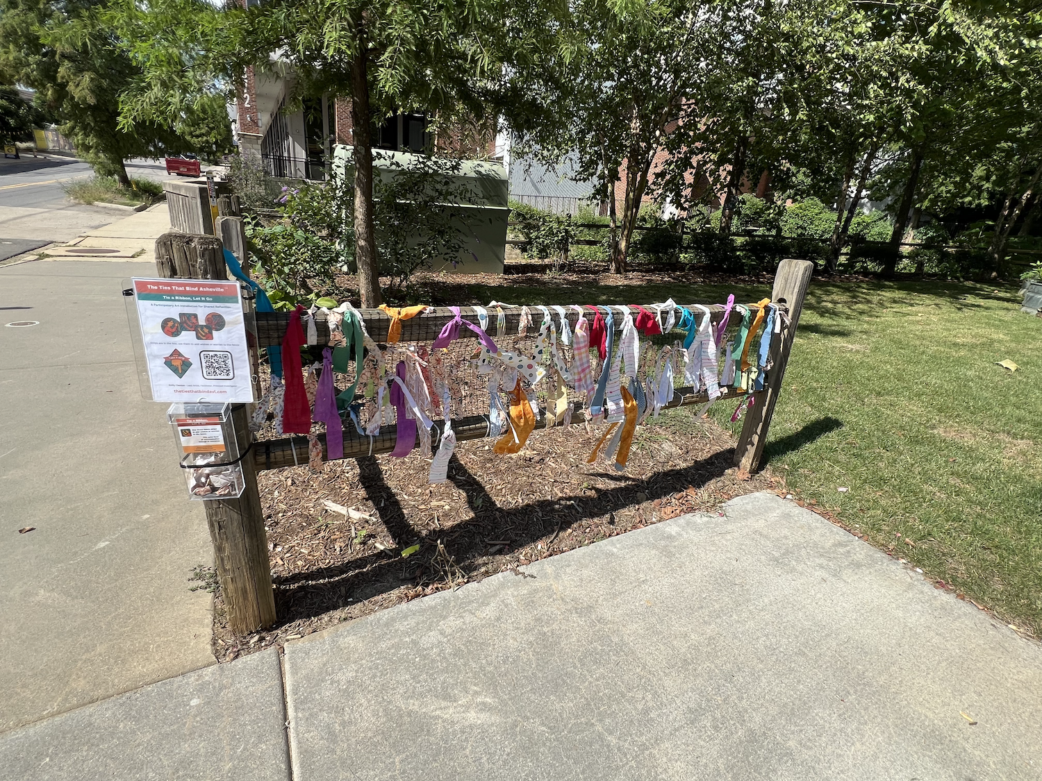 Deinstalling the day after Local Cloth’s soft opening. The one-day-only installation, shaped by many visitors, will now be detached and reassembled in sections on the fence at Riverside Drive.