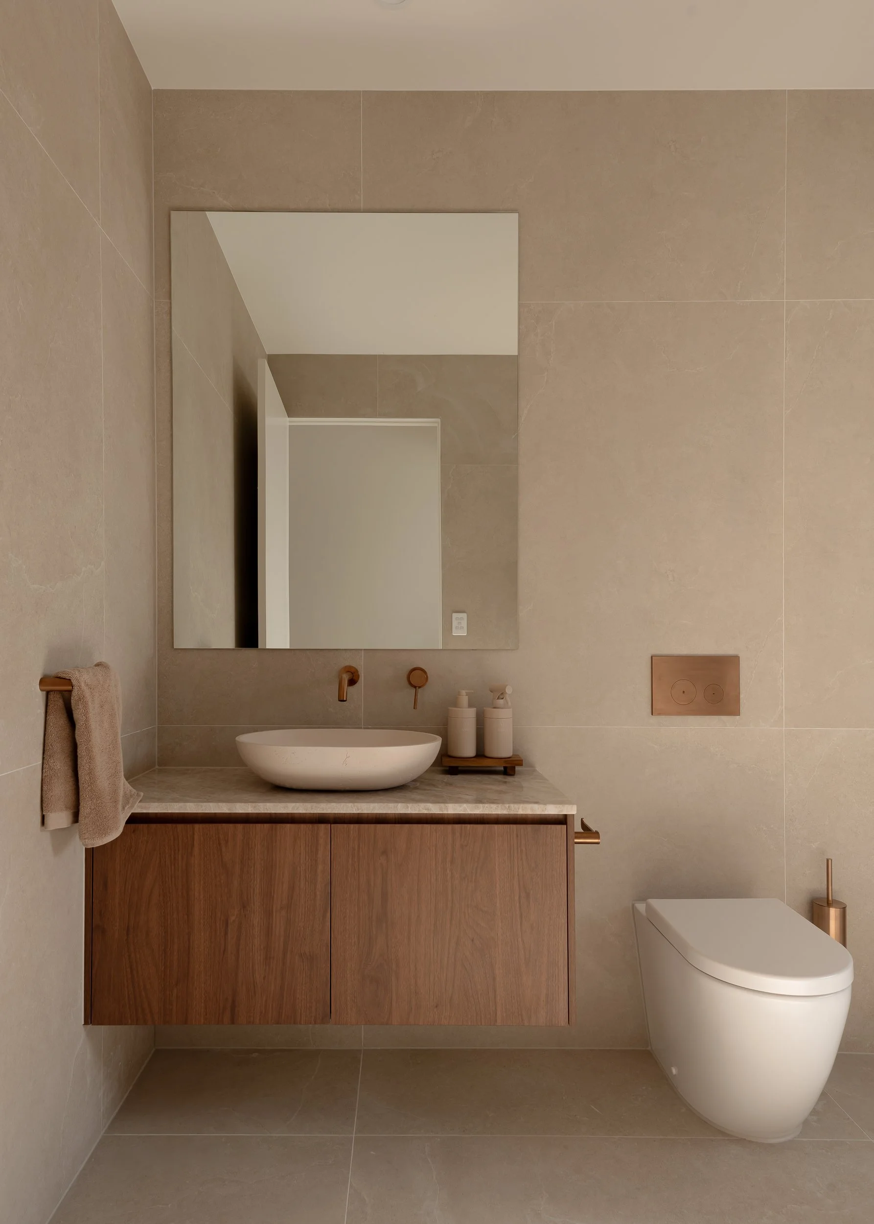 florentine walnut vanity, warm hues and natural stone benchtop