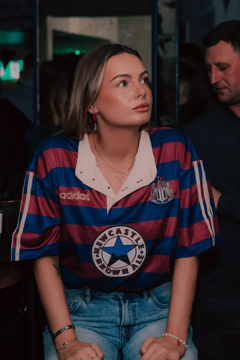 girl in the geordie star watching newcastle united