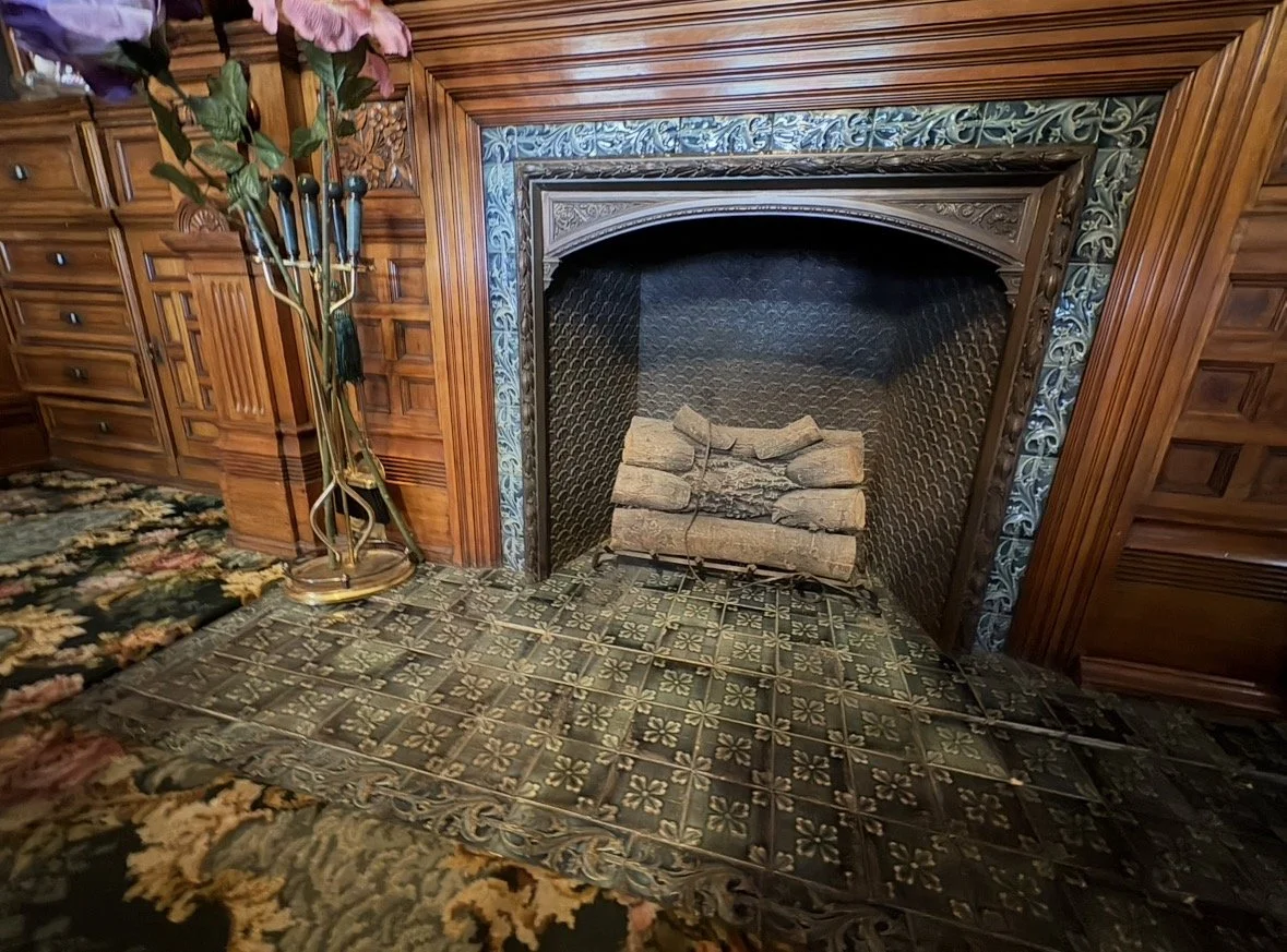 Decorative fireplace in the Curtis Mansion with blue floral tiles