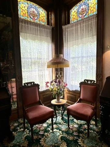 A cozy sitting nook in the George M. Curtis Mansion