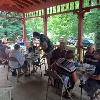 people at an event at the Curtis mansion