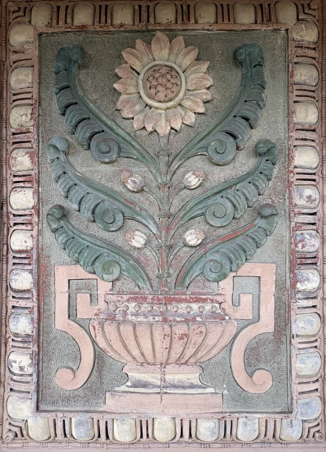 terracotta wall art of a sunflower