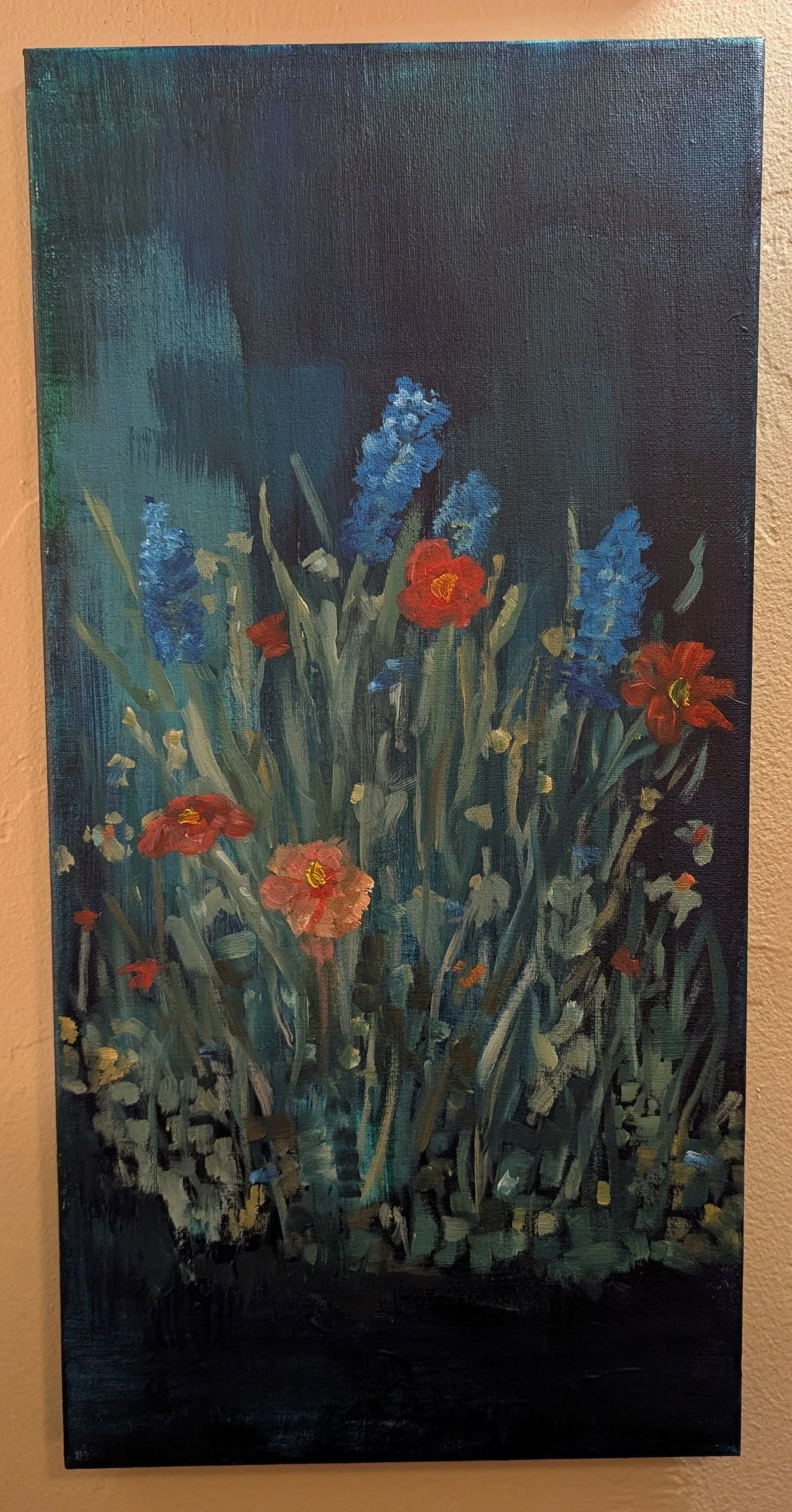 Oil painting of a bouquet of red and blue flowers with green leaves against a dark background.