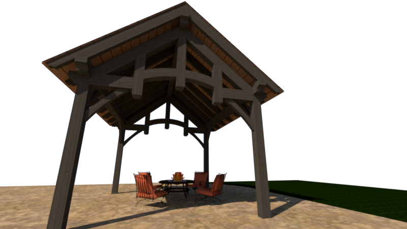 A wooden outdoor pavilion with a pitched roof, seating area with table and chairs, located on sandy ground with a grassy area in the background.