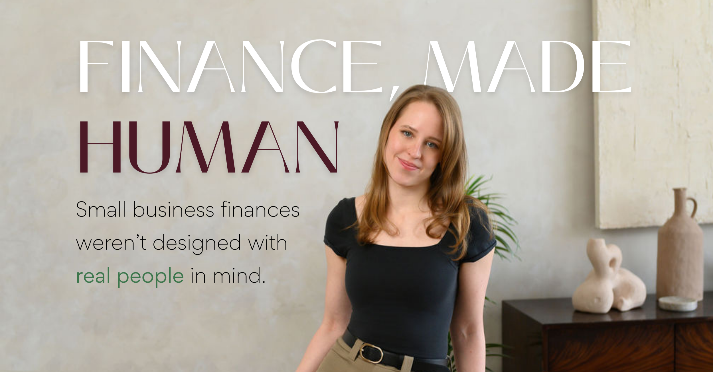 Emily Jachimiak, founder of SevaFi, standing in a neutral office space representing small business finance and fractional CFO support.