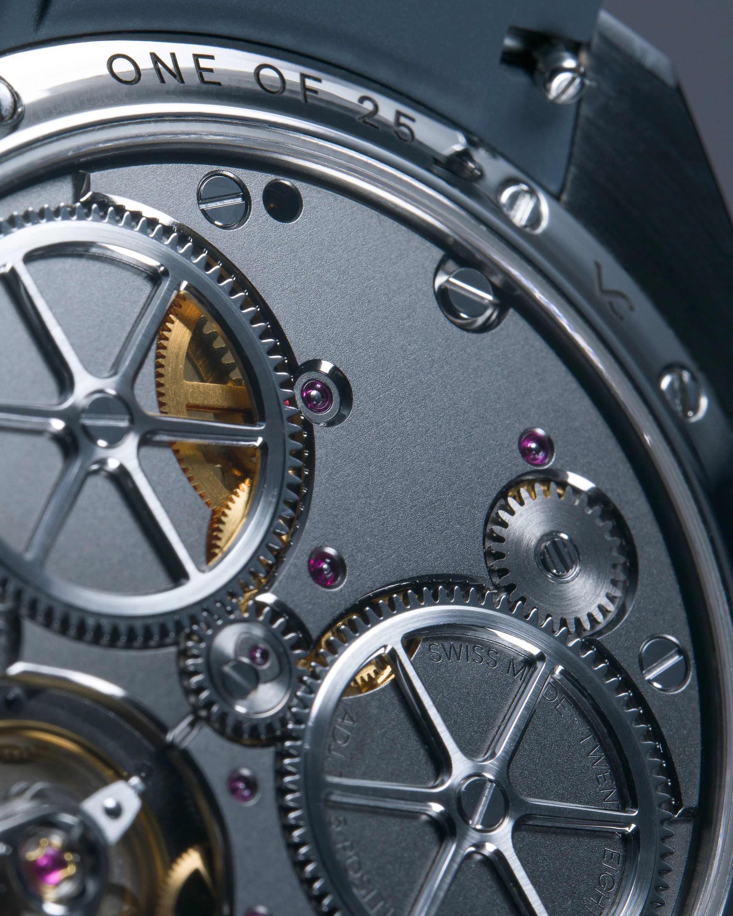 Close-up of a mechanical watch movement showing gears, screws, and intricate components.
