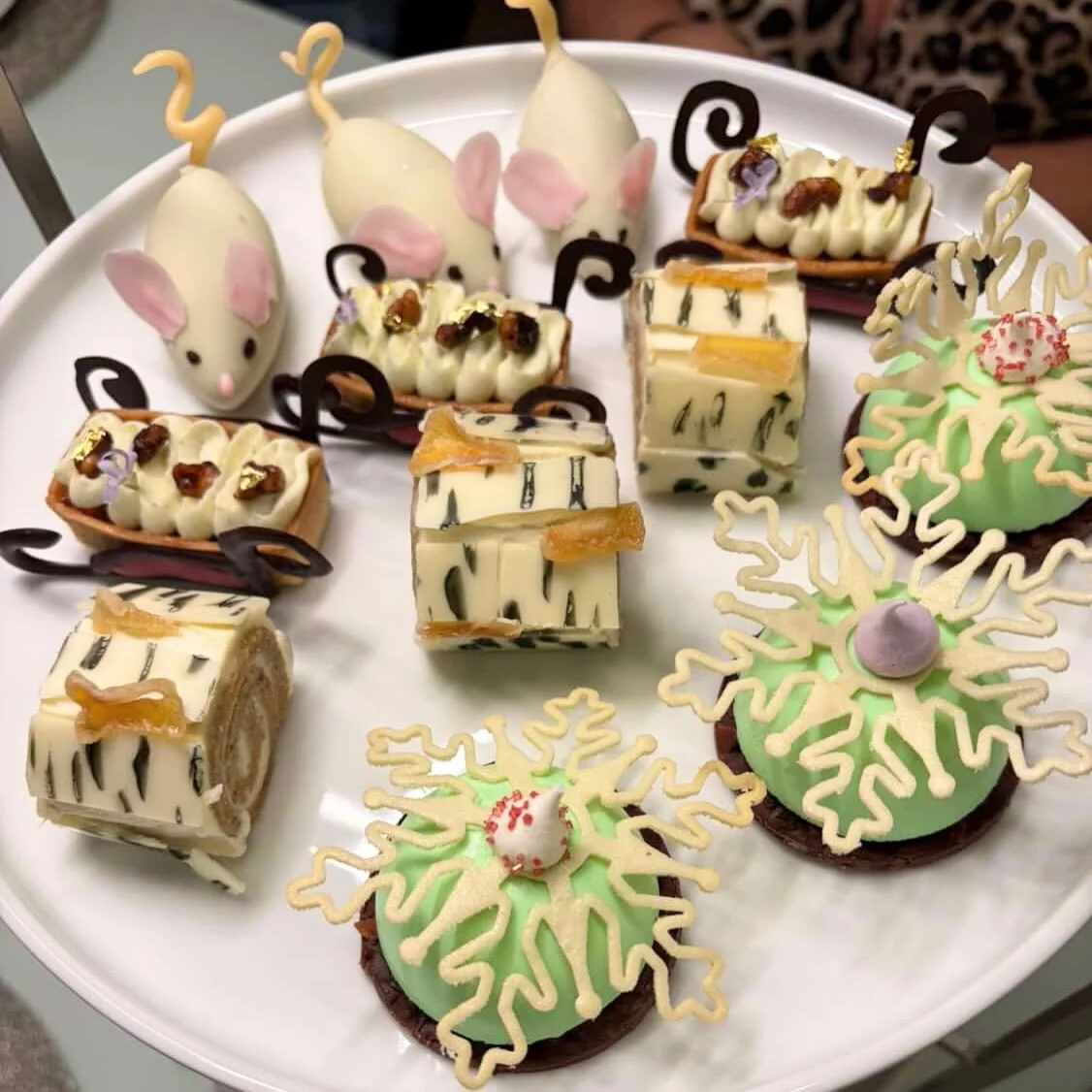 Treat yourself!!!! Take a peak at our tiny sweet treats for holiday Afternoon Tea. Chocolate mousse mice, mezcal pecan apple pie, a ginger&ndash;eggnog Yule log &amp; peppermint chocolate domes are luxurious bites of festive flavors. 
Perfect for coz