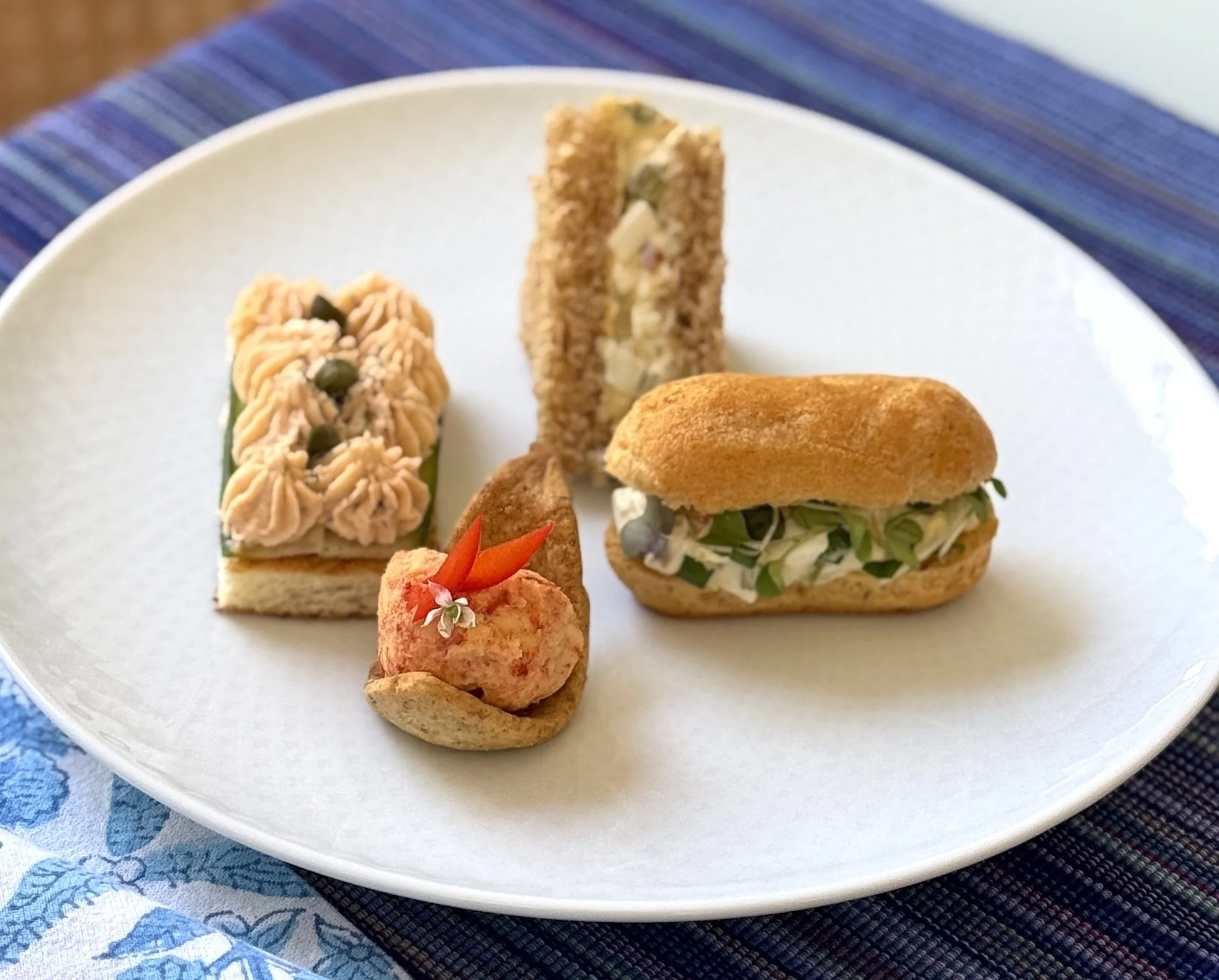 Four Tea sandwiches: smoked salmon/cucumber, egg salad, chicken salad and pimento cheese