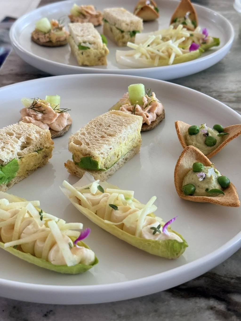 Plates of Savory Afternoon Tea Sandwiches inspired by London