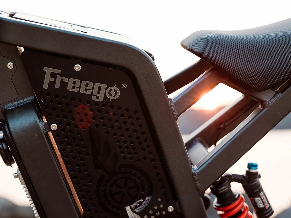 Close-up of a Freego electric bicycle with a focus on the frame and seat, showing suspension and branding.