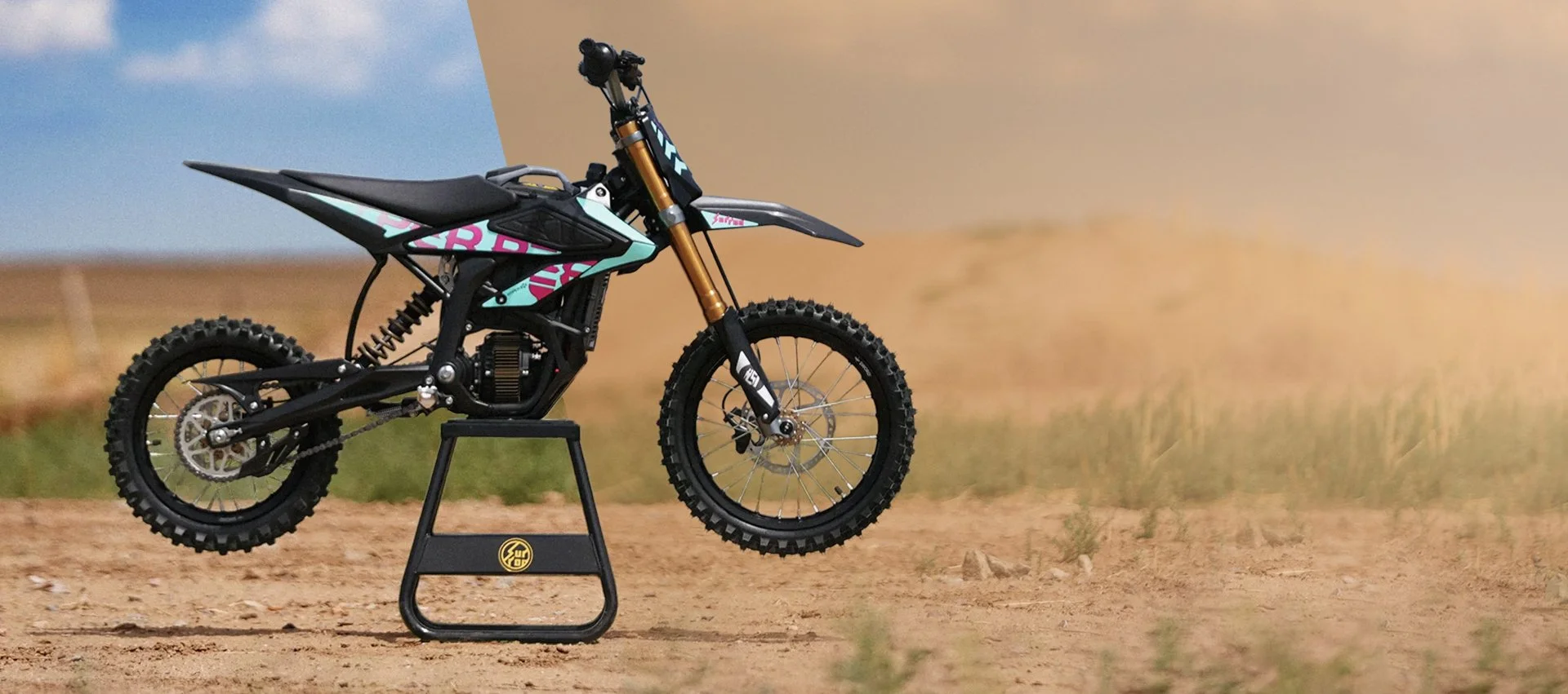Off-road dirt bike motocross motorcycle on a stand in an outdoor desert landscape. Surron Hyper Bee.