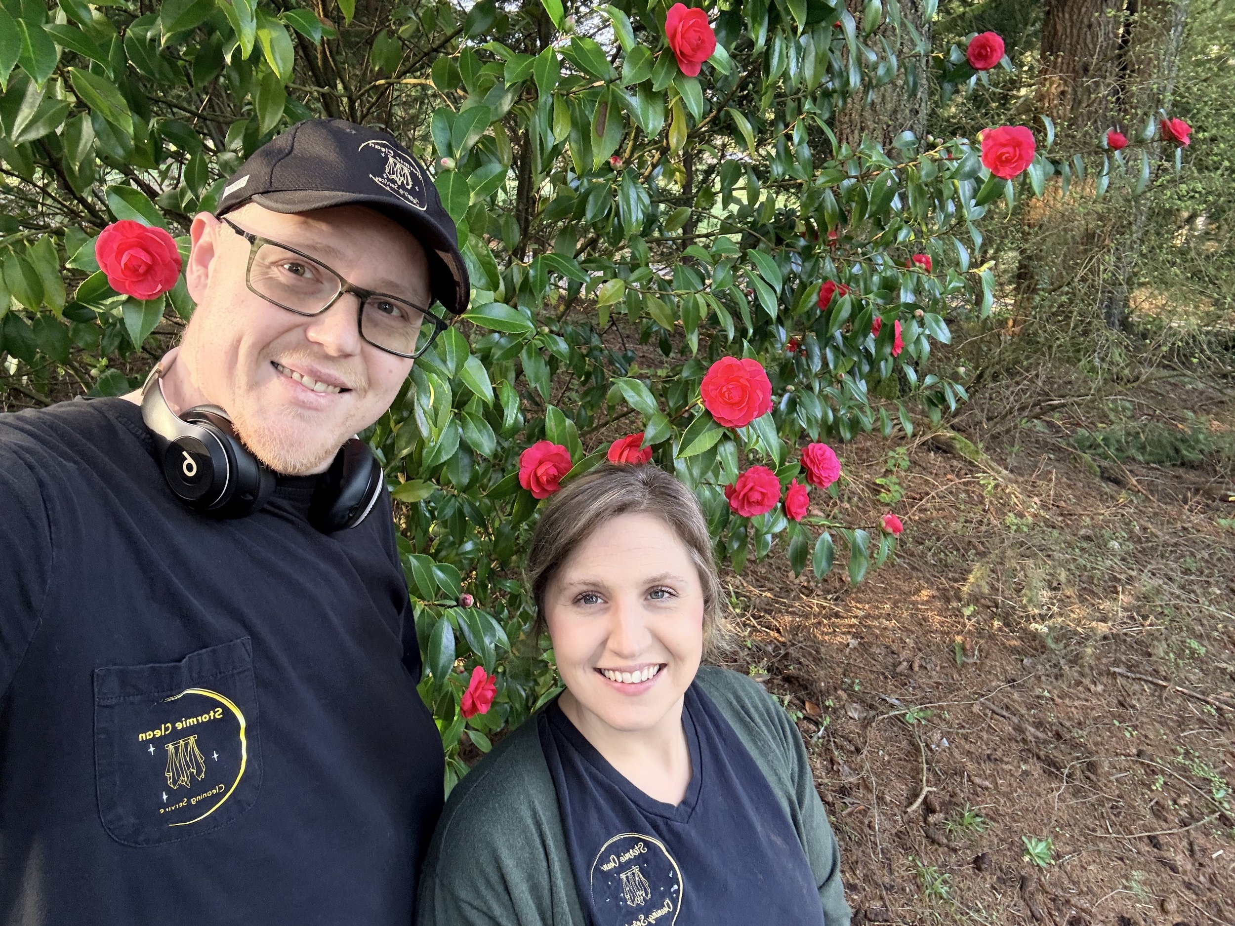 Taylor and Stormie In front of a rose bush.