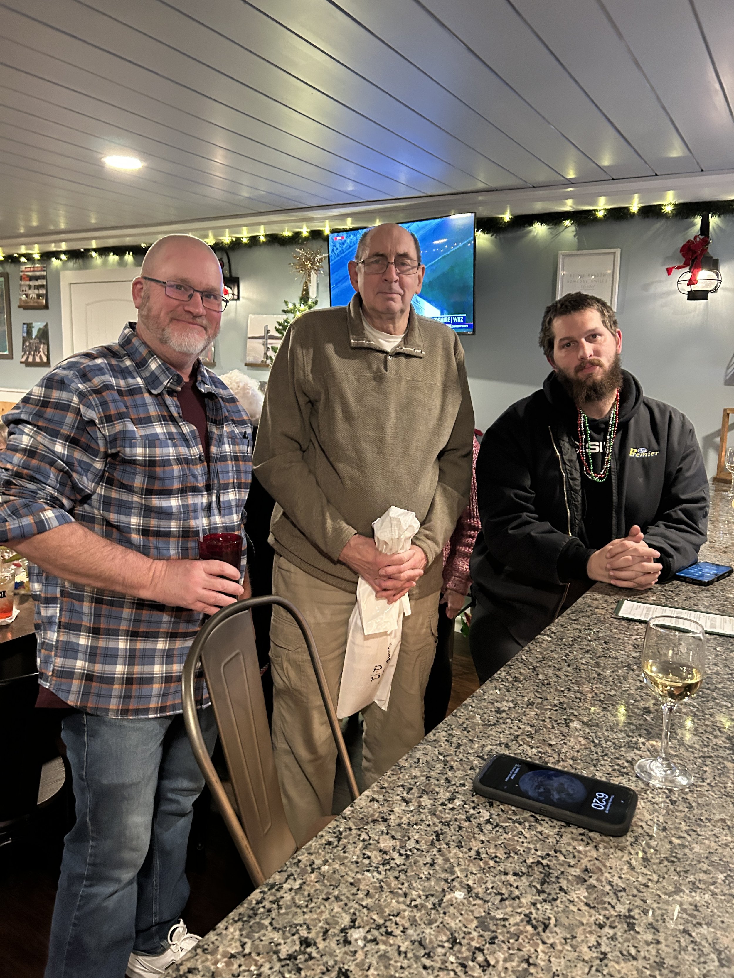 Club President; Doug Towne Sr., Vice President; Erik Jensen, and member; Doug Towne Jr. at the 2025 holiday banquet.