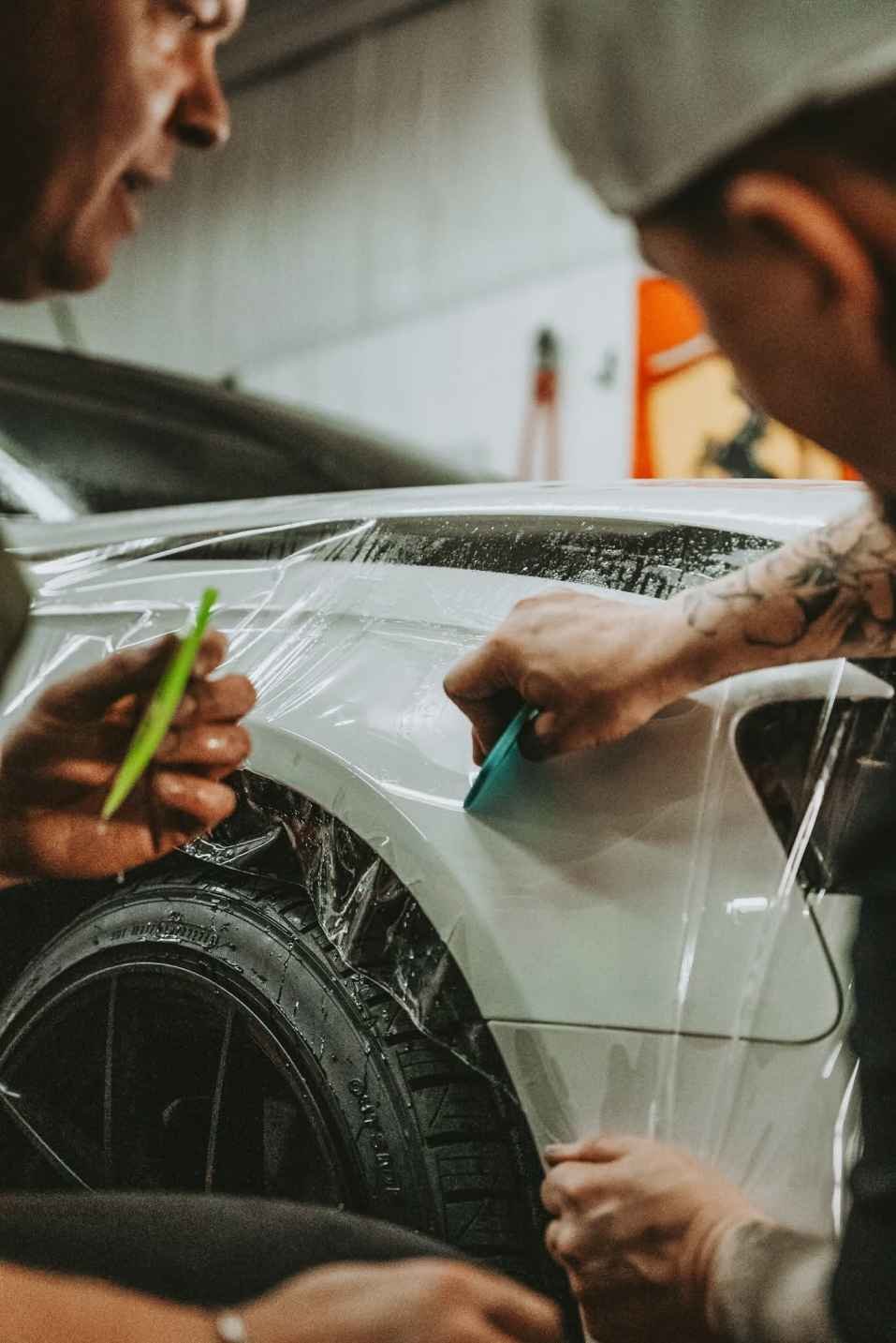 Clear bra PPF installation on a luxury vehicle for rock chip protection.