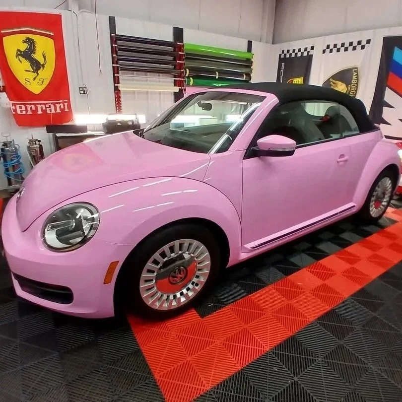 Pink convertible Volkswagen Beetle wrapped
