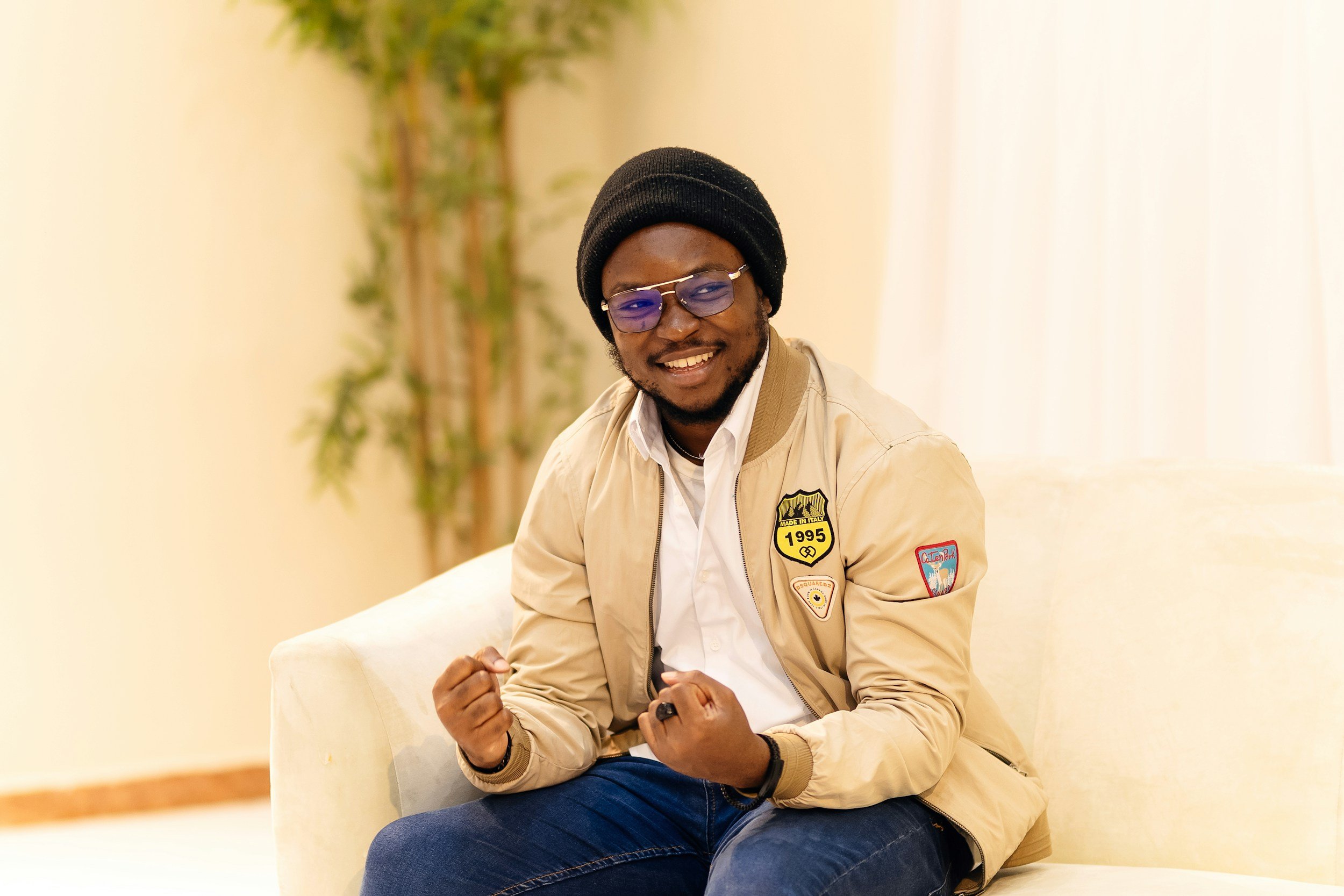 Man wearing glasses smiling because he's being seen at Garden State Ophthalmology by Dr. Effy Ojuok