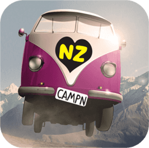 A pink and white Volkswagen bus with a black heart and yellow letters 'NZ' on the front, flying above mountains with a 'CAMP' license plate.