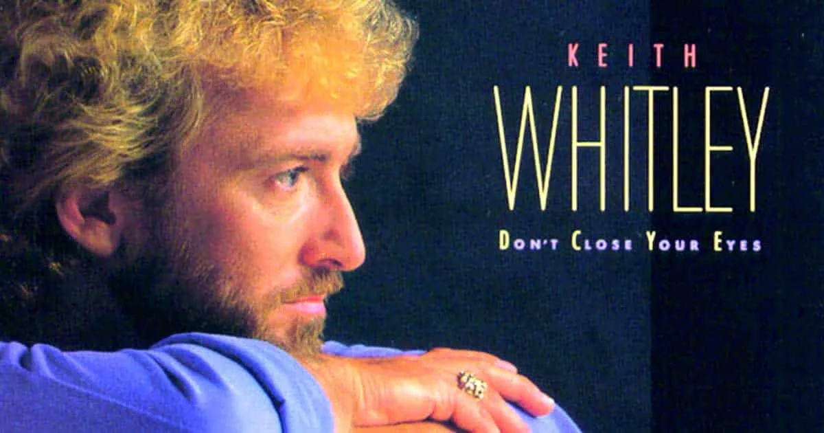 Close-up of Keith Whitley's face with a contemplative expression, resting his head on his arm, with album title "Don't Close Your Eyes" in the background.