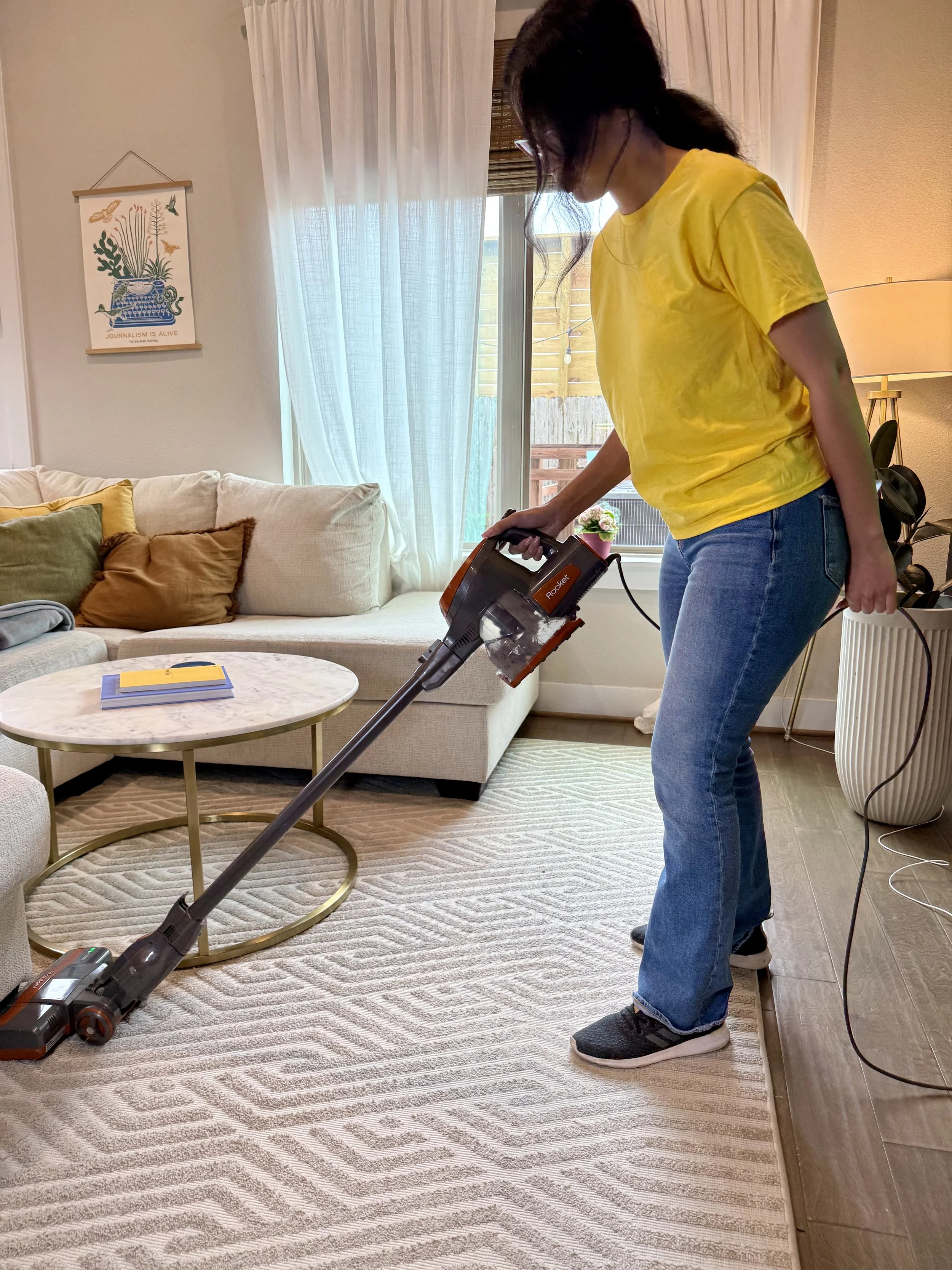 Maid cleaning a living room with vacumm deep cleaning in spring,tx