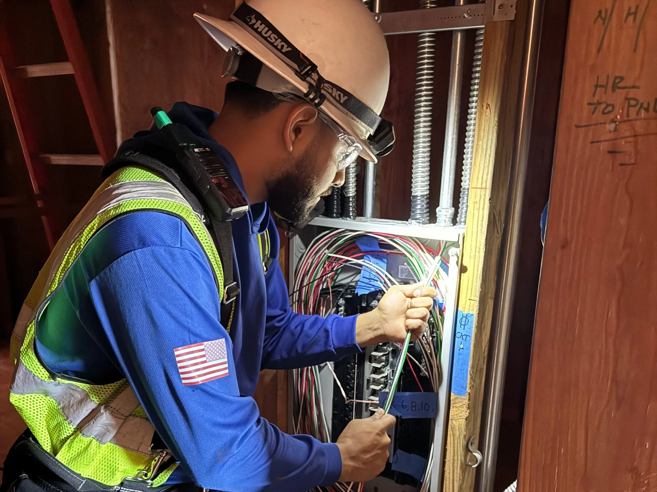 Oranssi technician working on a roof project