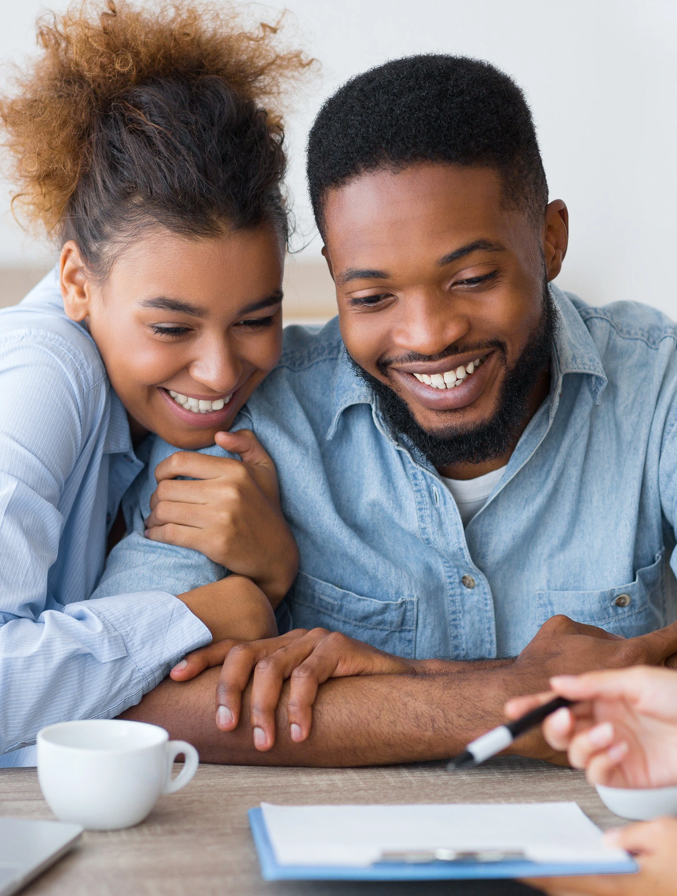 joyful-afro-couple-sitting-family-counselors-office.jpg